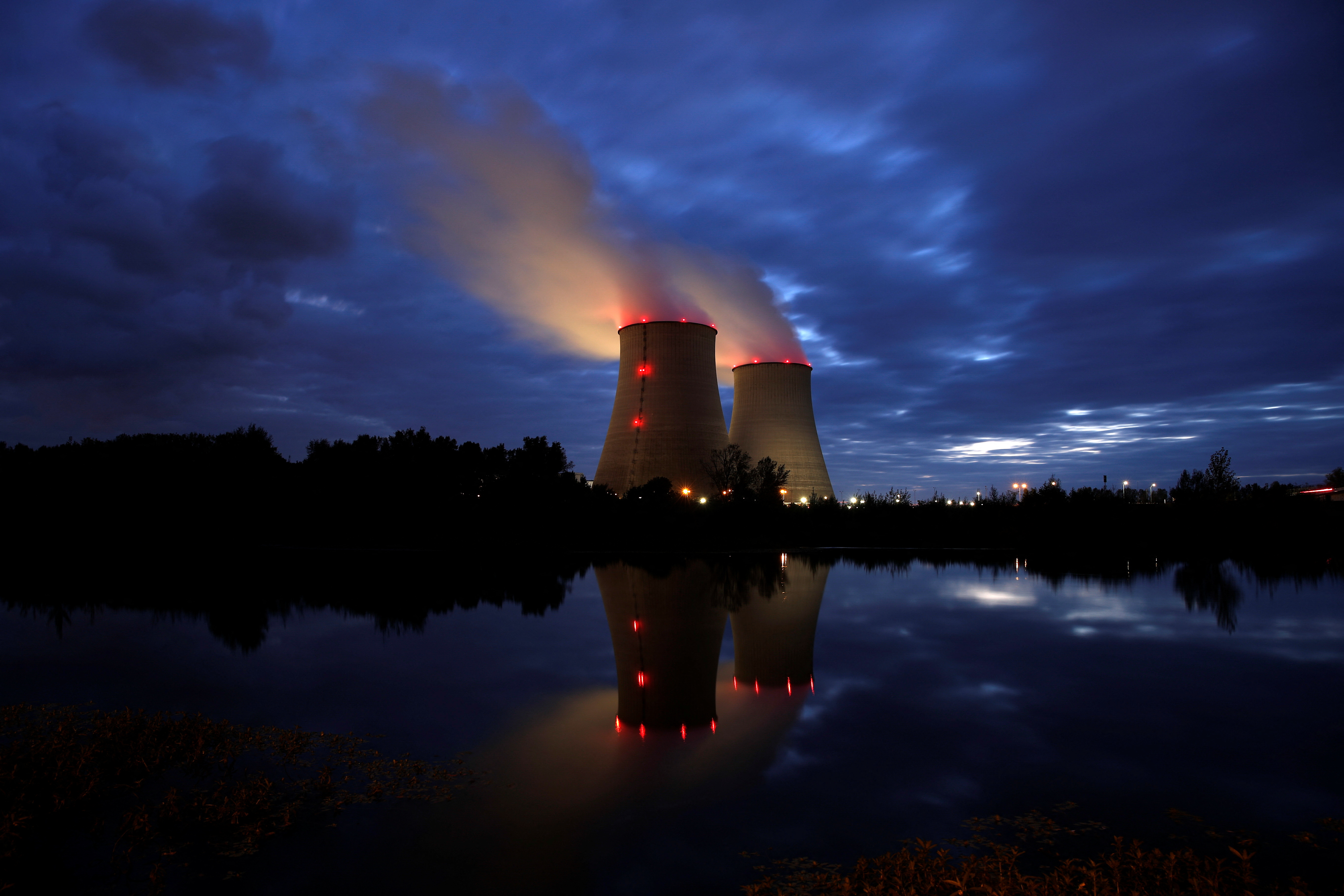 Steam rises from cooling towers of the Electricite de France (EDF) nuclear power plant in Belleville-sur-Loire, France October 12, 2021. REUTERS/Benoit Tessier