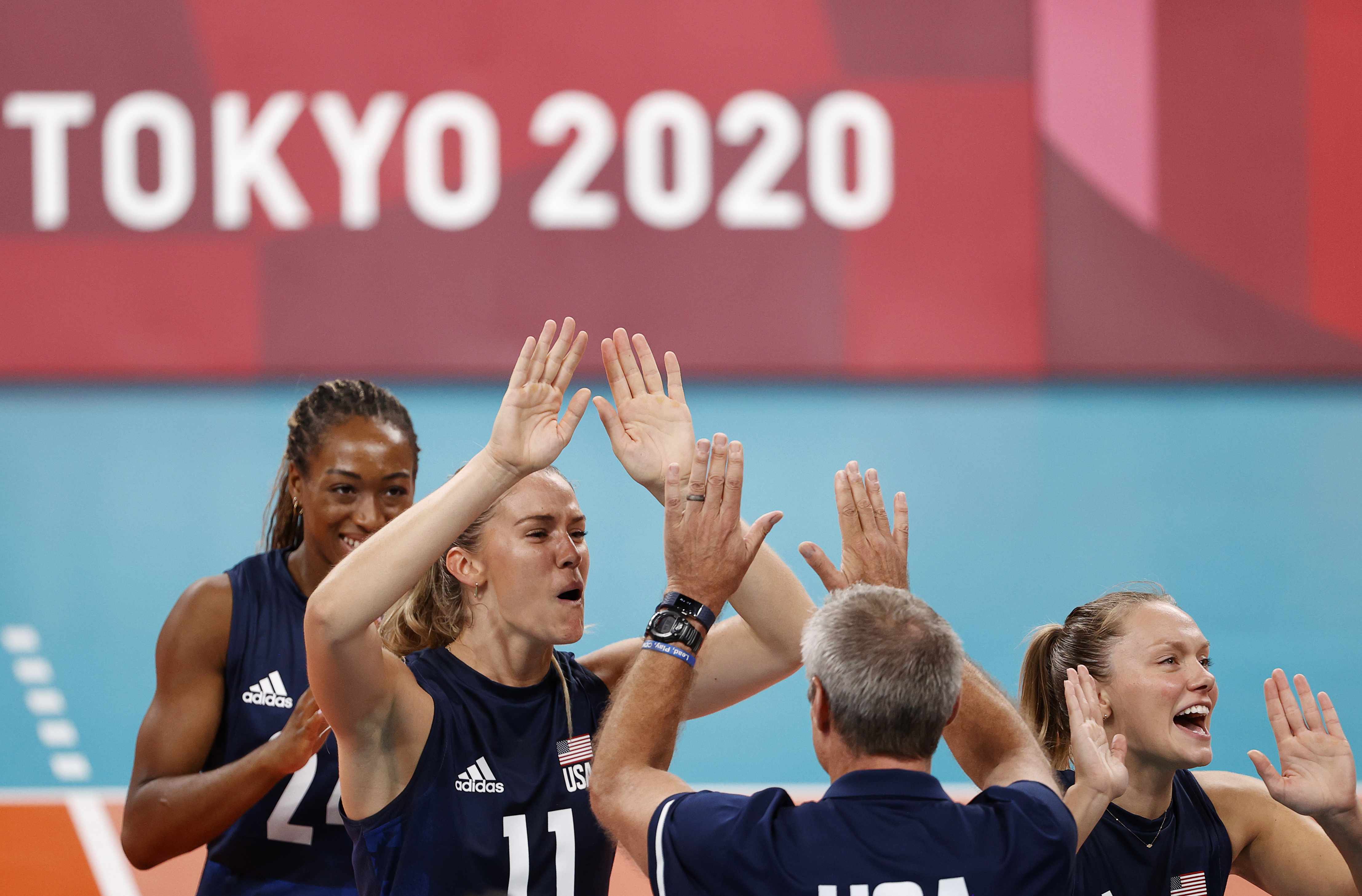 Tokyo 2020 Olympics - Volleyball - Women's Semifinal - Serbia v USA - Ariake Arena, Tokyo, Japan – August 6, 2021. Andrea Drews of the United States celebrates with The United States coach Charles Kiraly. REUTERS/Valentyn Ogirenko