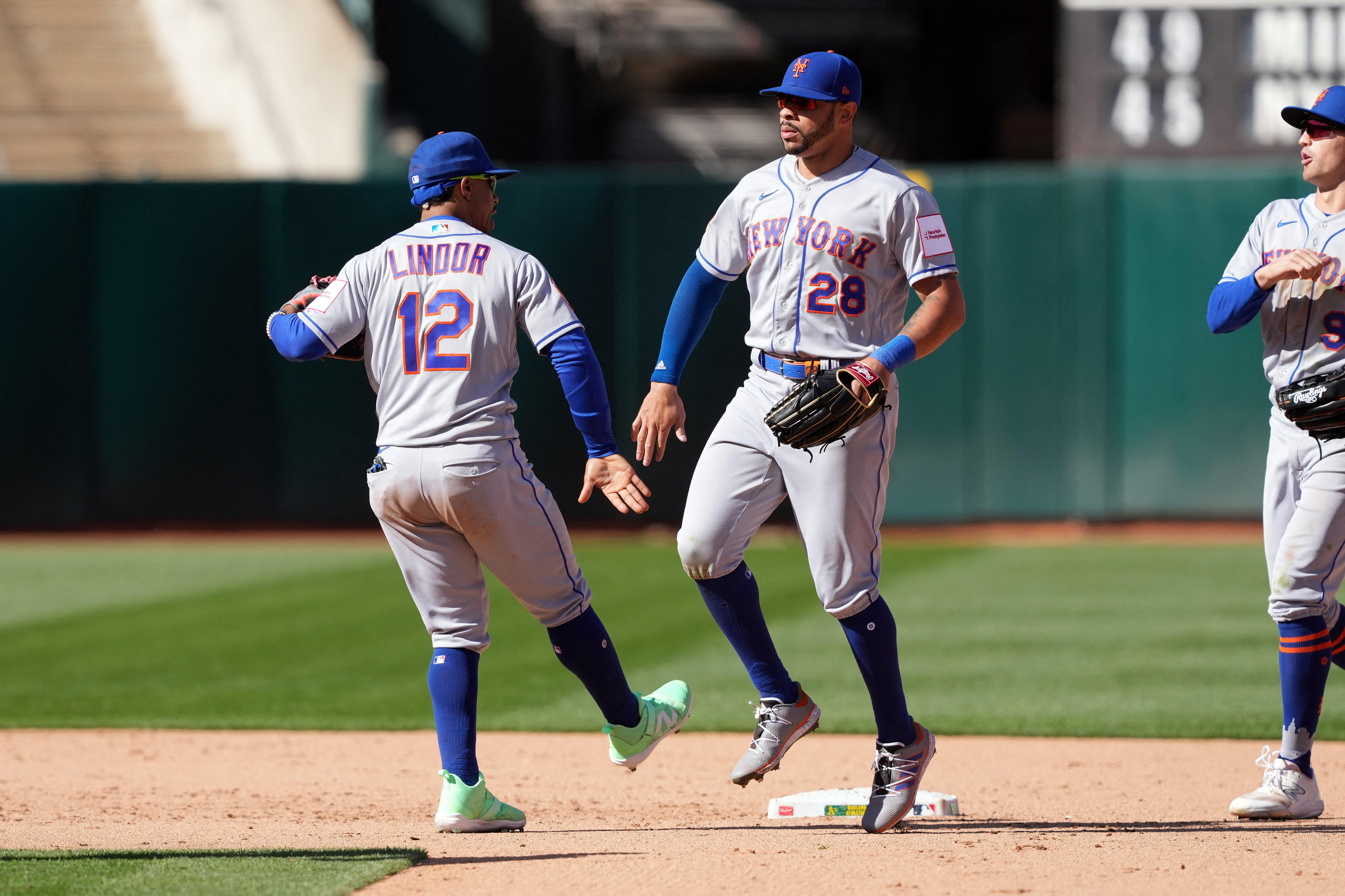 New York Mets Eduardo Escobar wears a New York Presbyterian