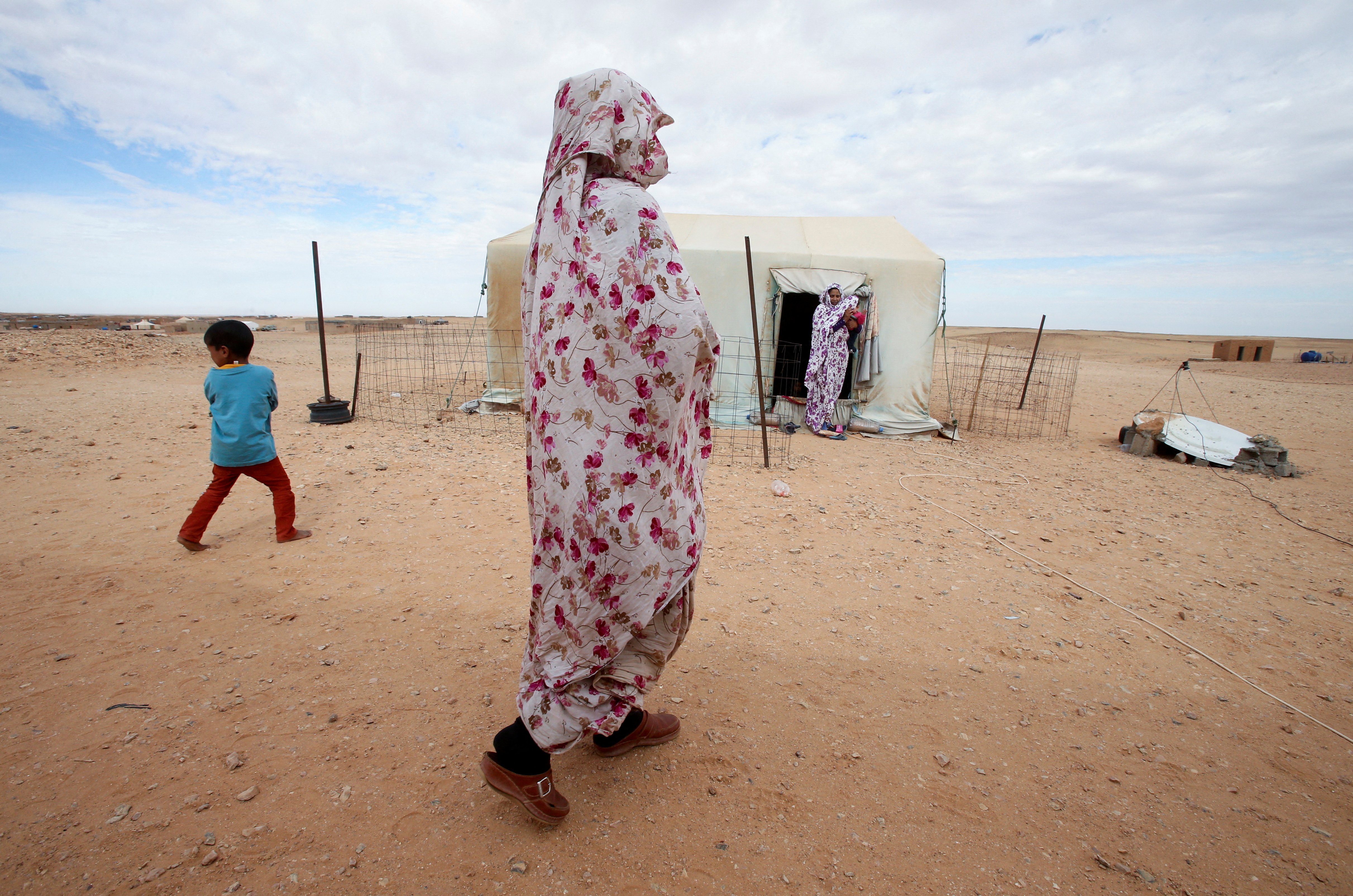 A woman walks at a Sahrawi refugee camp in Tindouf