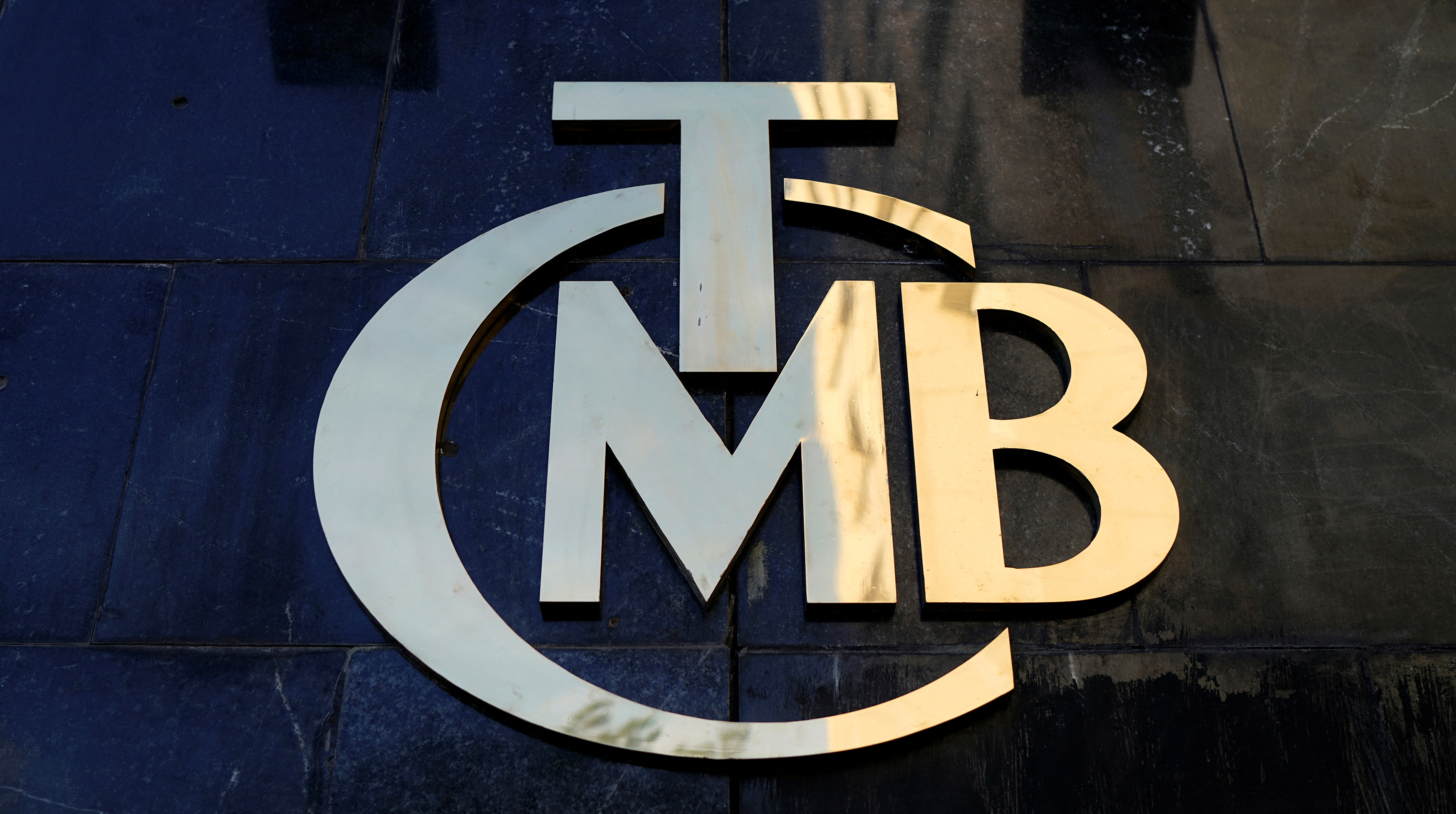 A logo of Turkey's Central Bank is pictured at the entrance of the bank's headquarters in Ankara