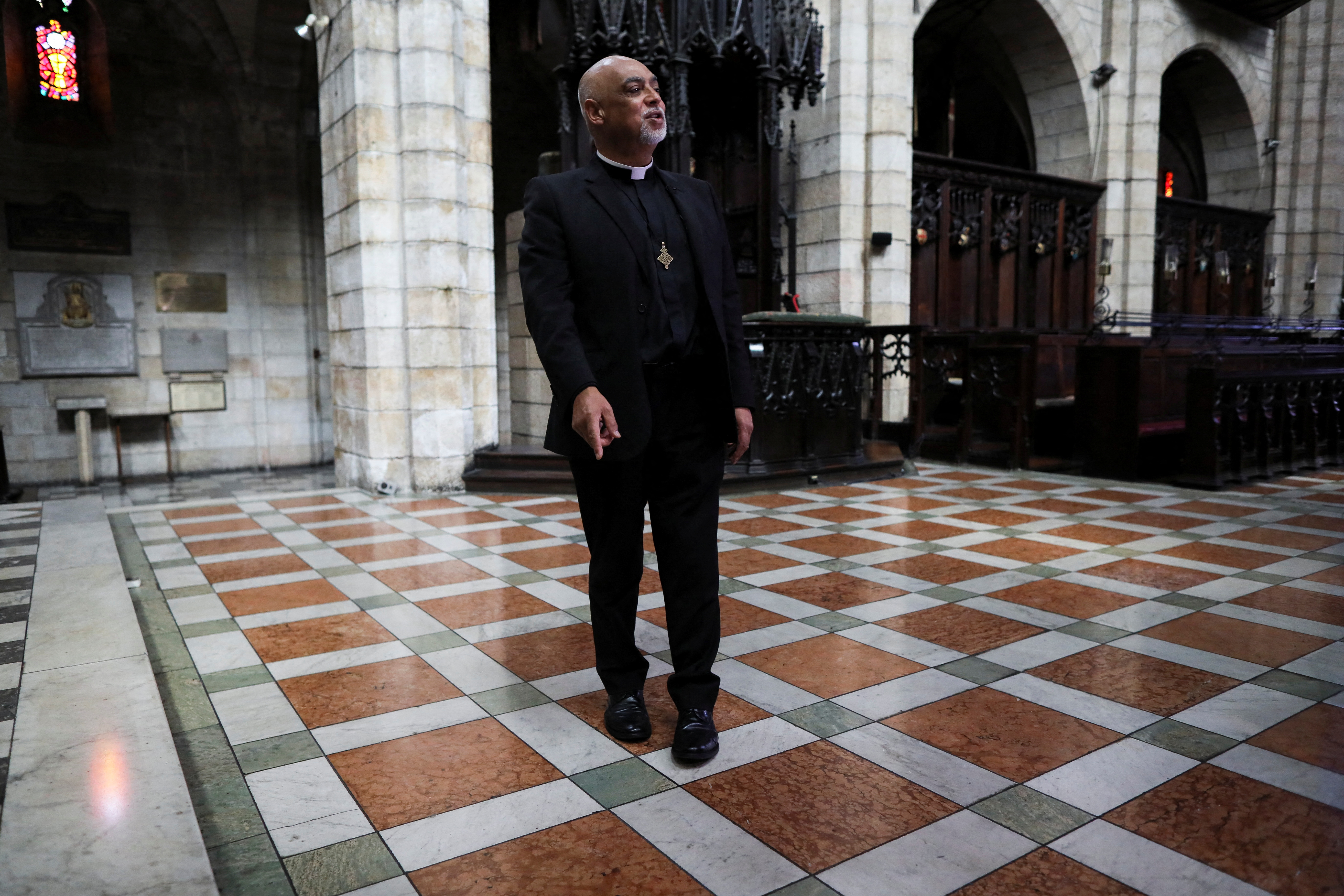 The Dean of St. George's Cathedral, the Very Reverend Michael Weeder points to the place where the remains of Archbishop Emeritus Desmond Tutu will be interred at St. George's Cathedral in Cape Town