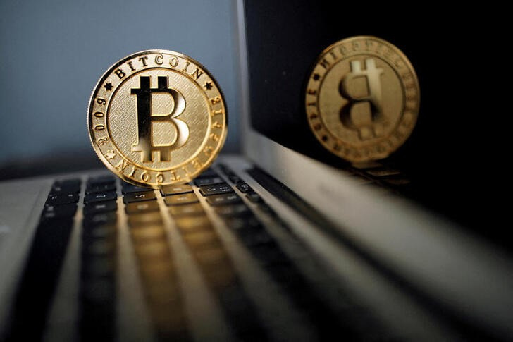 FILE PHOTO: bitcoin representation is seen in an illustration picture taken at La Maison du Bitcoin in Paris