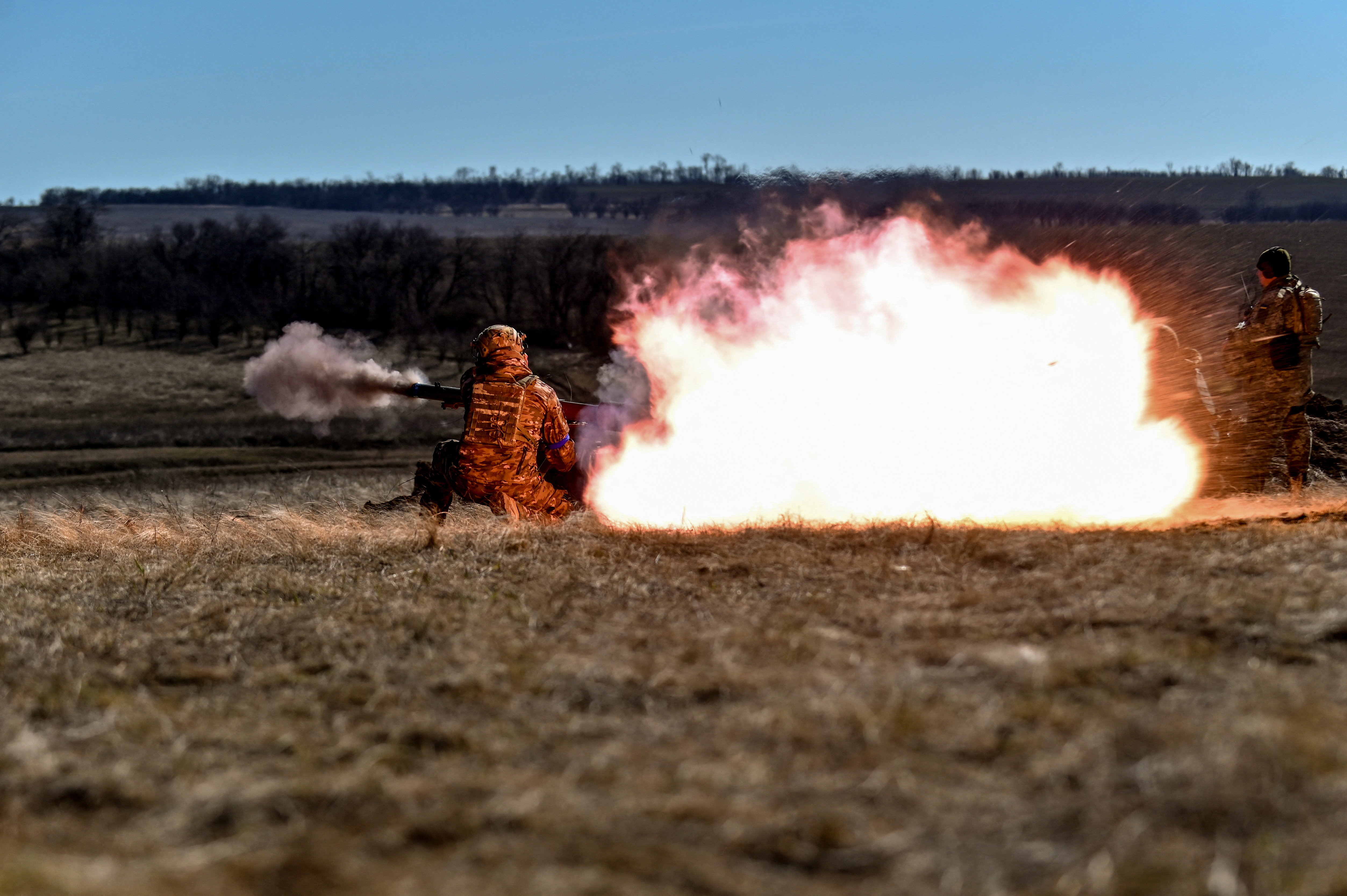 Ukrainian servicemen fire with a SPG-9 anti-tank grenade launcher during a military exercise in Zaporizhzhia region