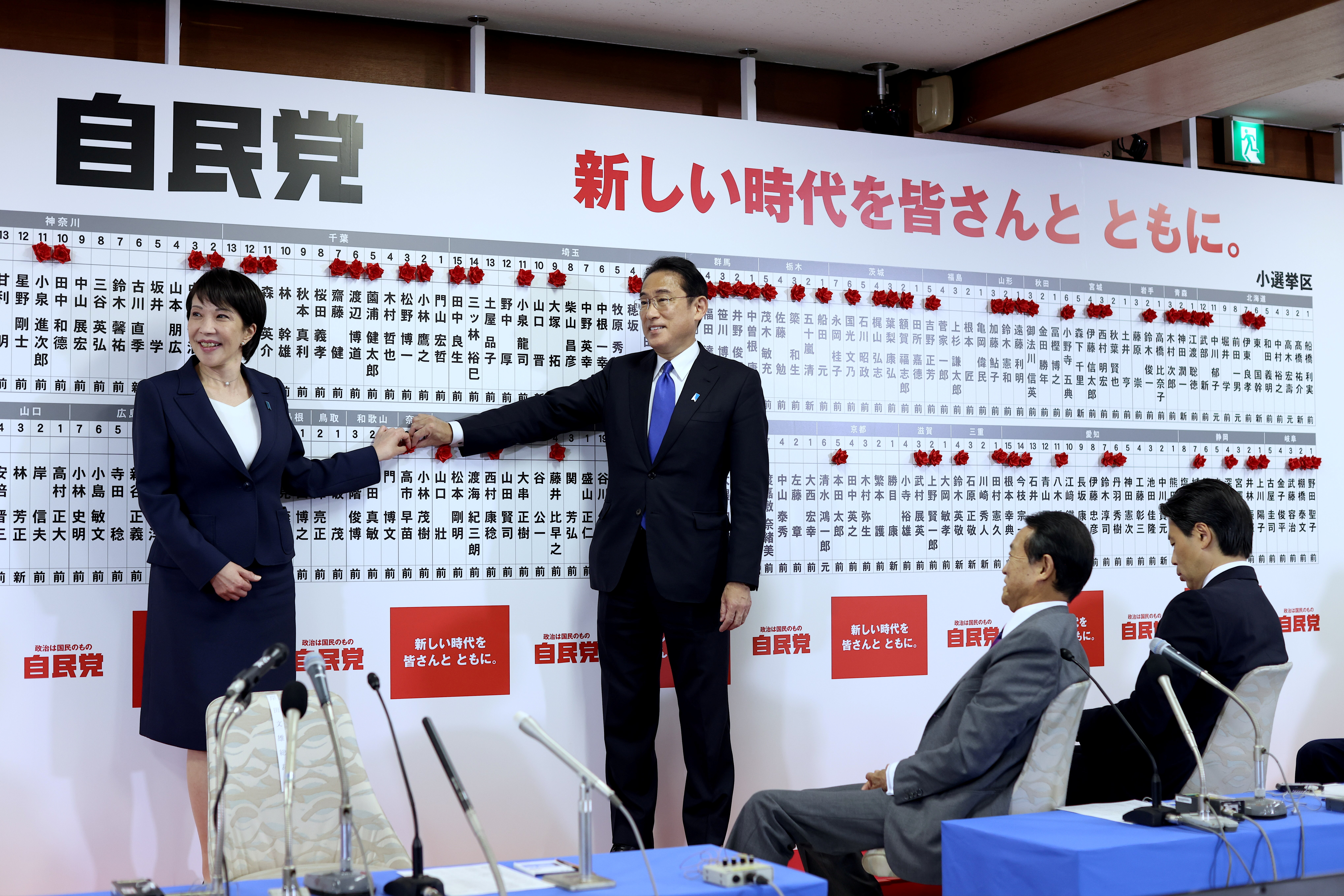 Japan's Prime Minister and ruling Liberal Democratic Party leader Fumio Kishida and former minister of the hall internal affairs and a senior member of the party, Sanae Takaichi put a rosette on her name after winning a seat at the lower house parliament,