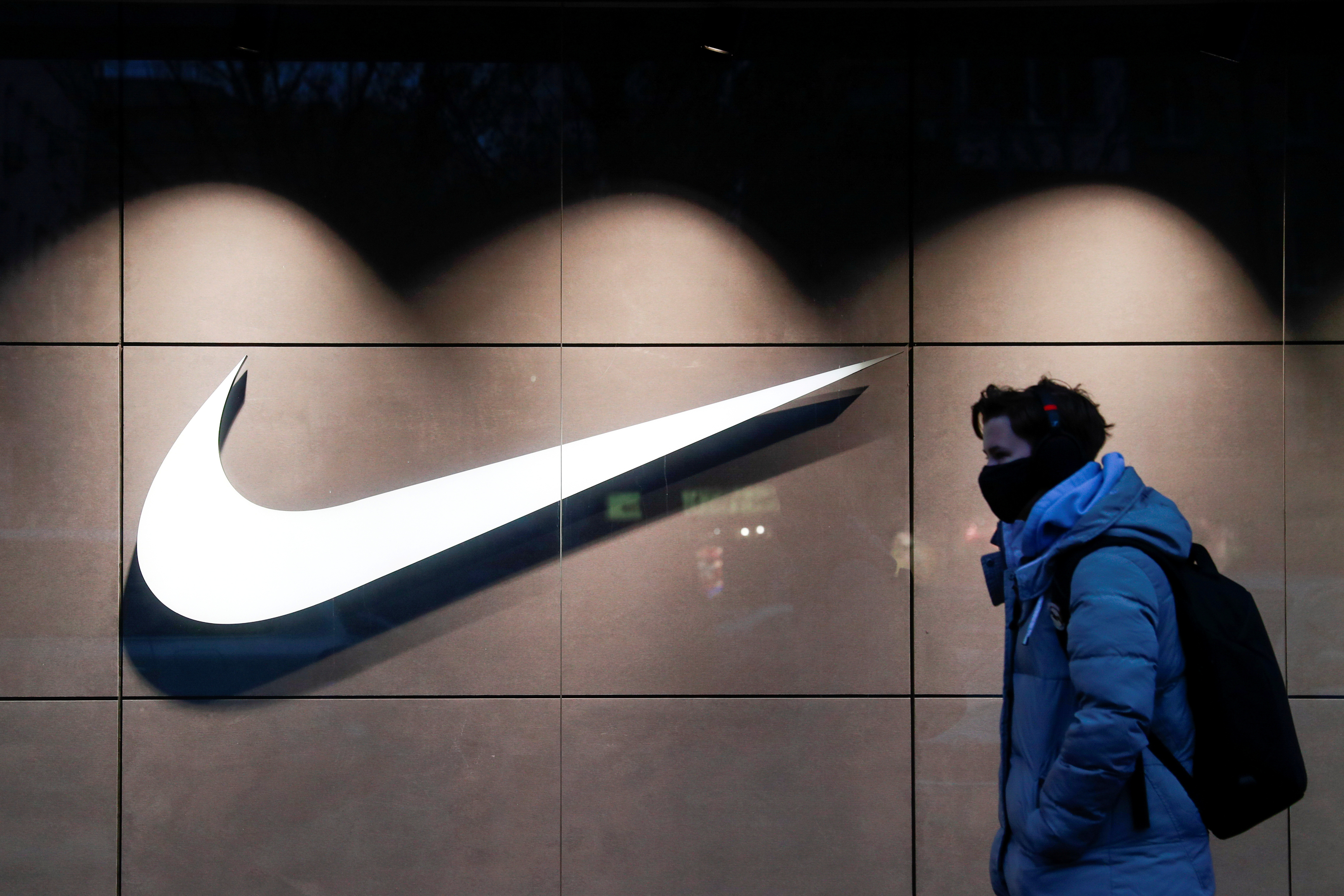 A person walks past a Nike brand store in Kyiv