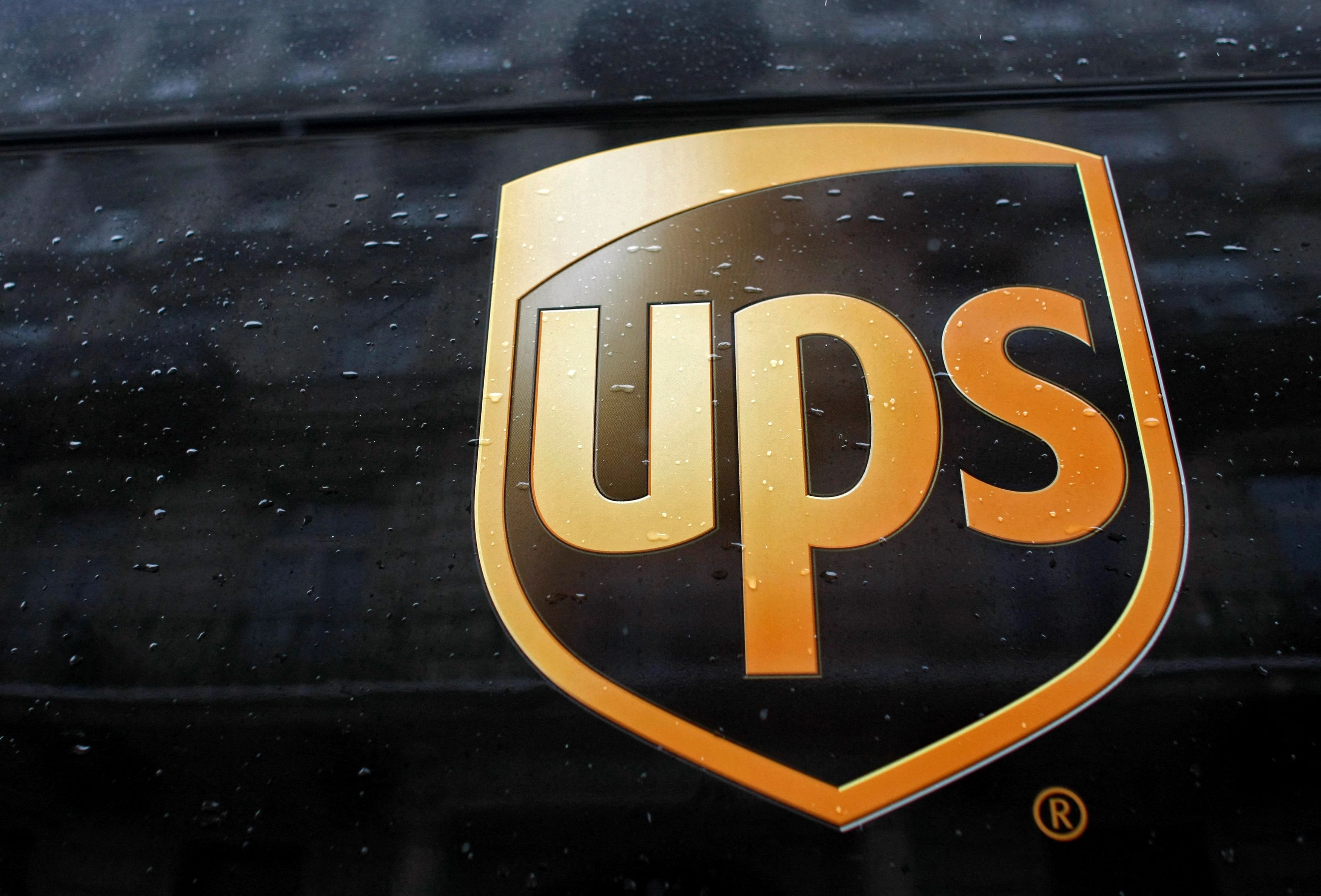 A United Parcel Service logo is seen on a car in center of Warsaw
