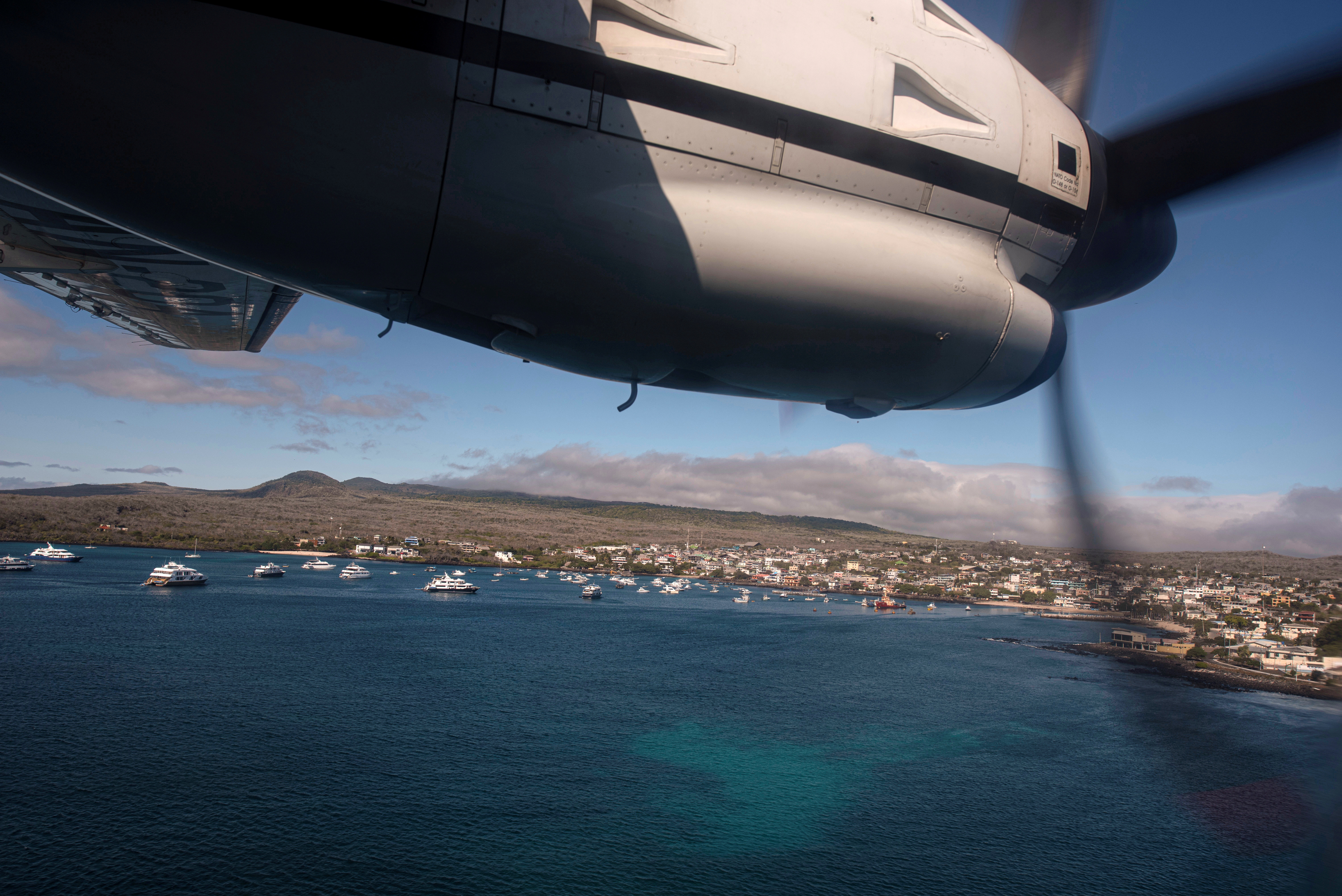 An Ecuadorian navy aircraft is preparing to land in San Cristobal, Galapagos Islands