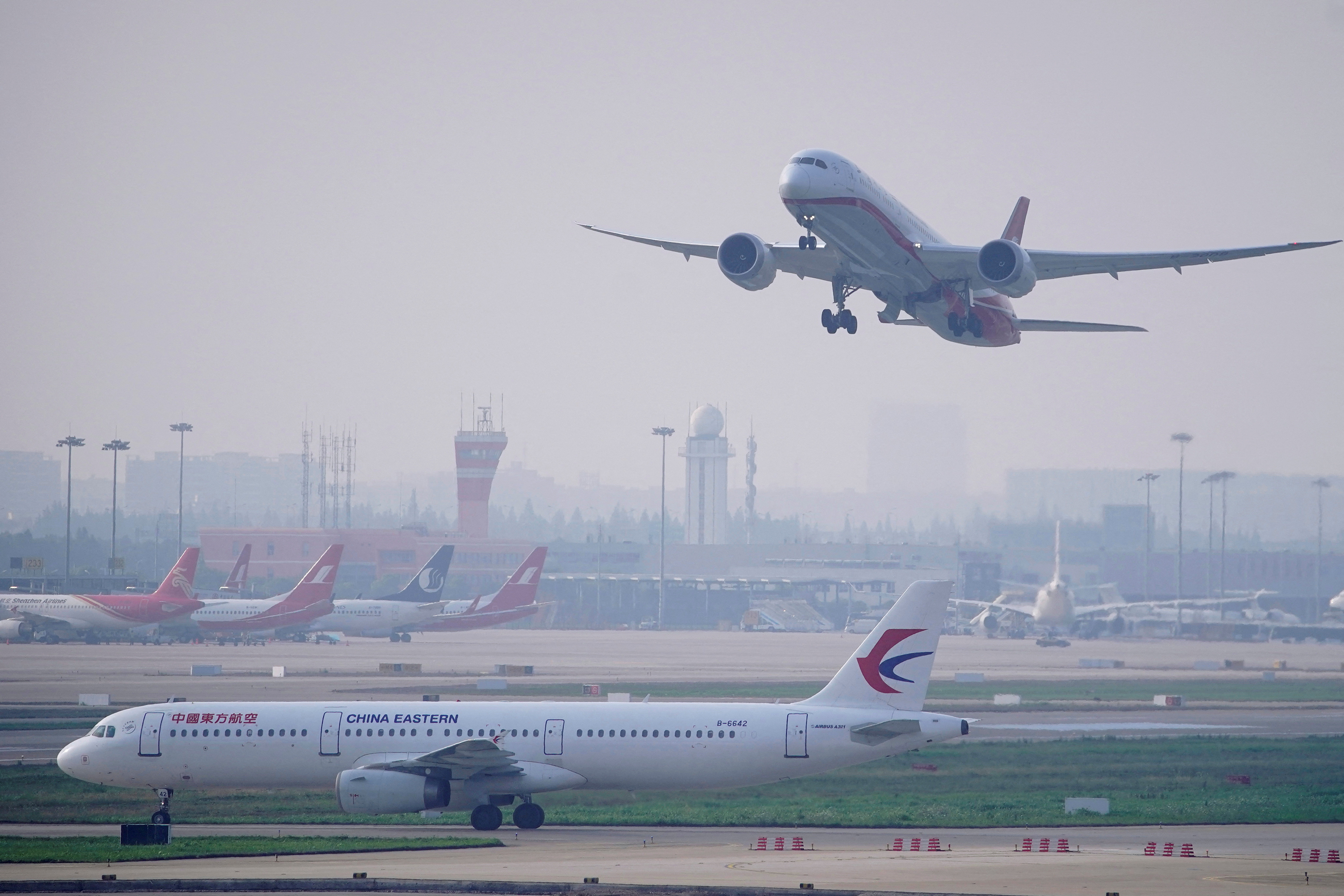 A China Eastern Airlines aircraft and  Shanghai Airlines aircraft are seen in Hongqiao International Airport in Shanghai