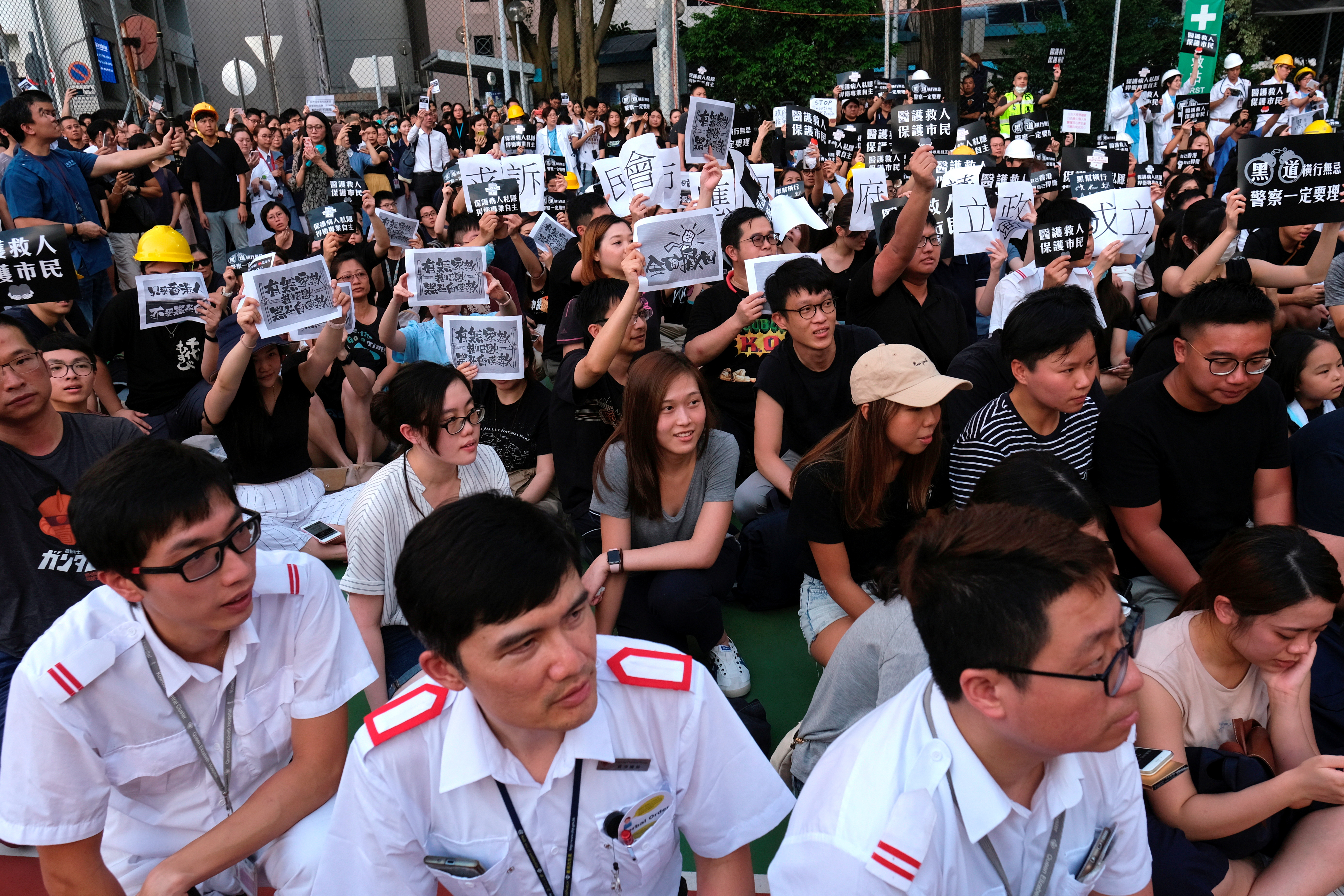 Public hospital doctors, nurses and employees attend a rally against Sunday’s Yuen Long violent attacks over extradition bill protesters and citizens, at Queen Elizabeth Hospital, in Hong Kong, China July 26, 2019. REUTERS/Tyrone Siu/File Photo