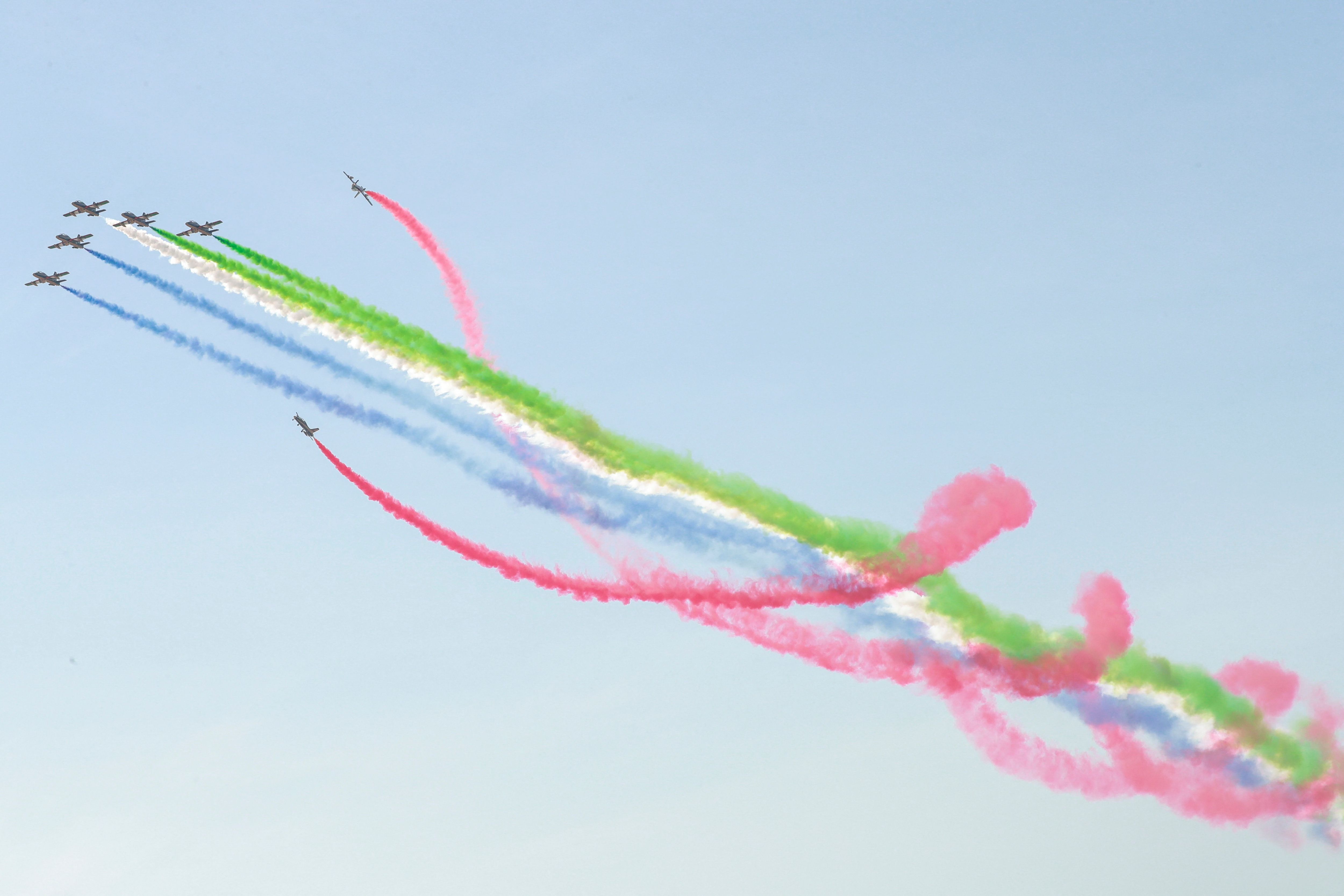 Aircrafts perform during an airshow at NAVDEX, an annual event that happens alonside the International Defence Exhibition and Conference (IDEX) in Abu Dhabi