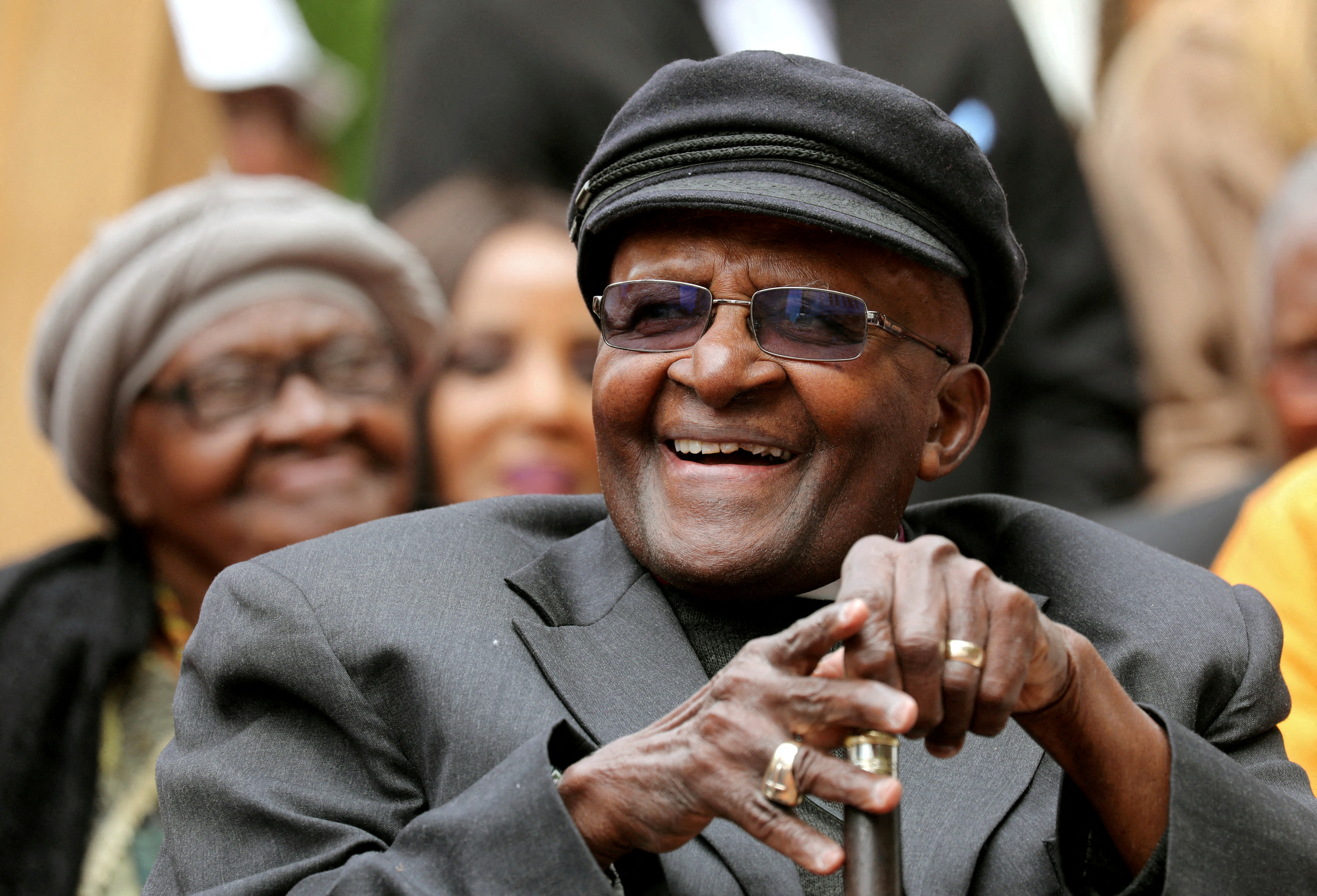 Archbishop Desmond Tutu laughs as crowds gather to celebrate his birthday by unveiling an arch in his honour outside St George's Cathedral in Cape Town