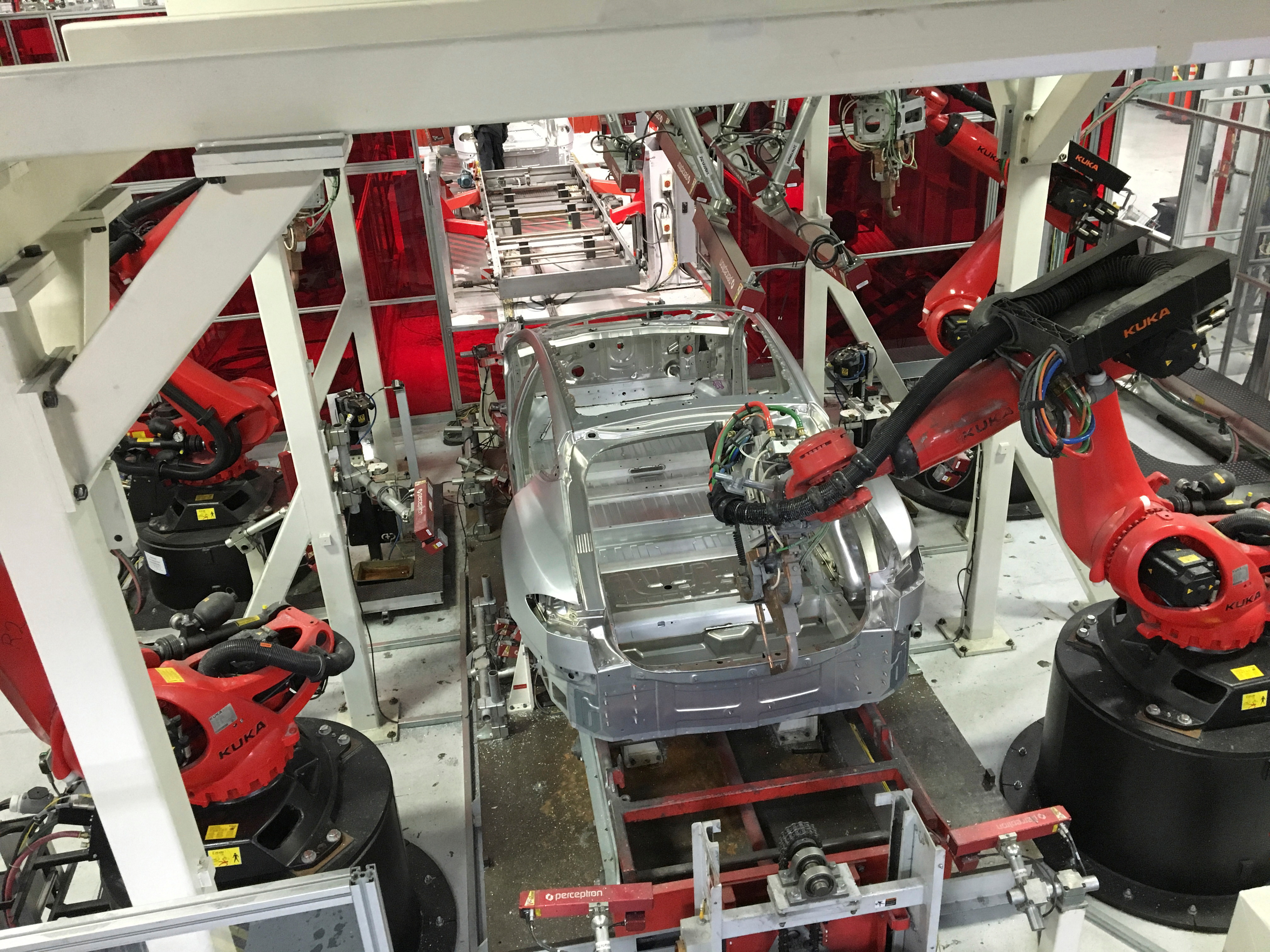 Tesla vehicles are being assembled by robots at Tesla Motors Inc factory in Fremont