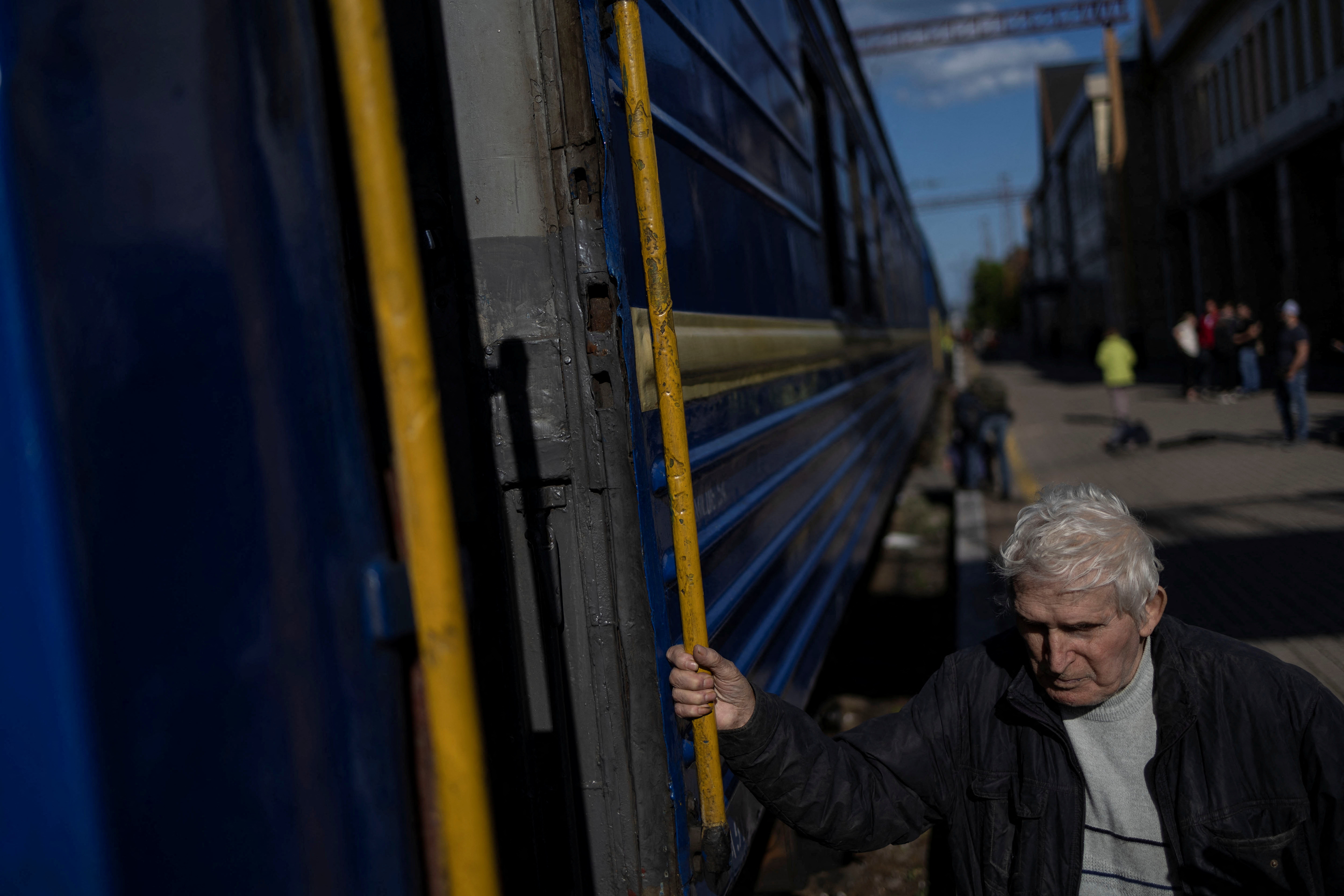 A local resident boards a train as he evacuate from war-affected areas of eastern Ukraine, amid Russia's invasion of the country, in Pokrovsk, Donetsk region, Ukraine
