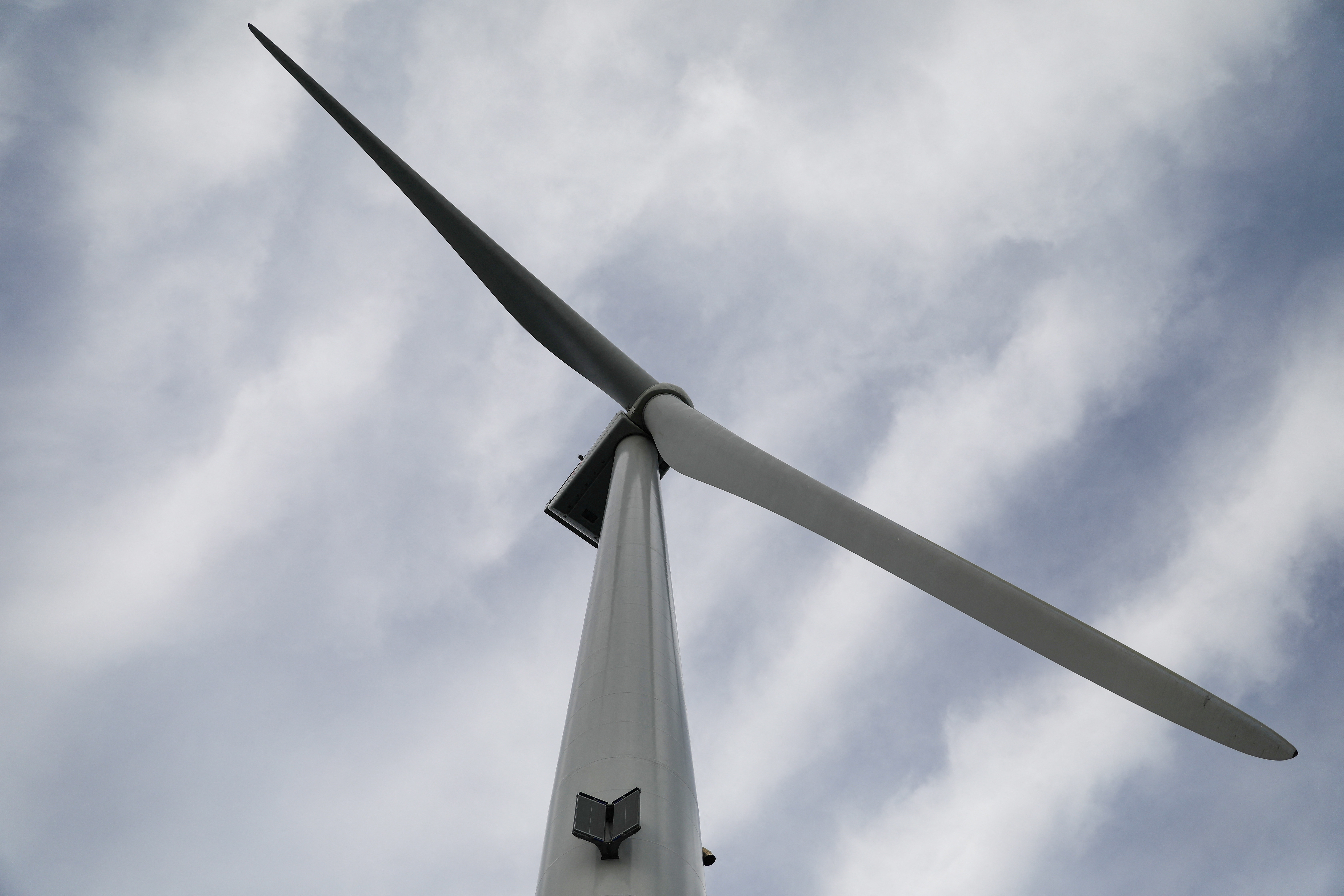 A turbine of the WindFloat Atlantic Project, a floating offshore wind-power generating platform, is seen 20 kilometers off the coast in Viana do Castelo