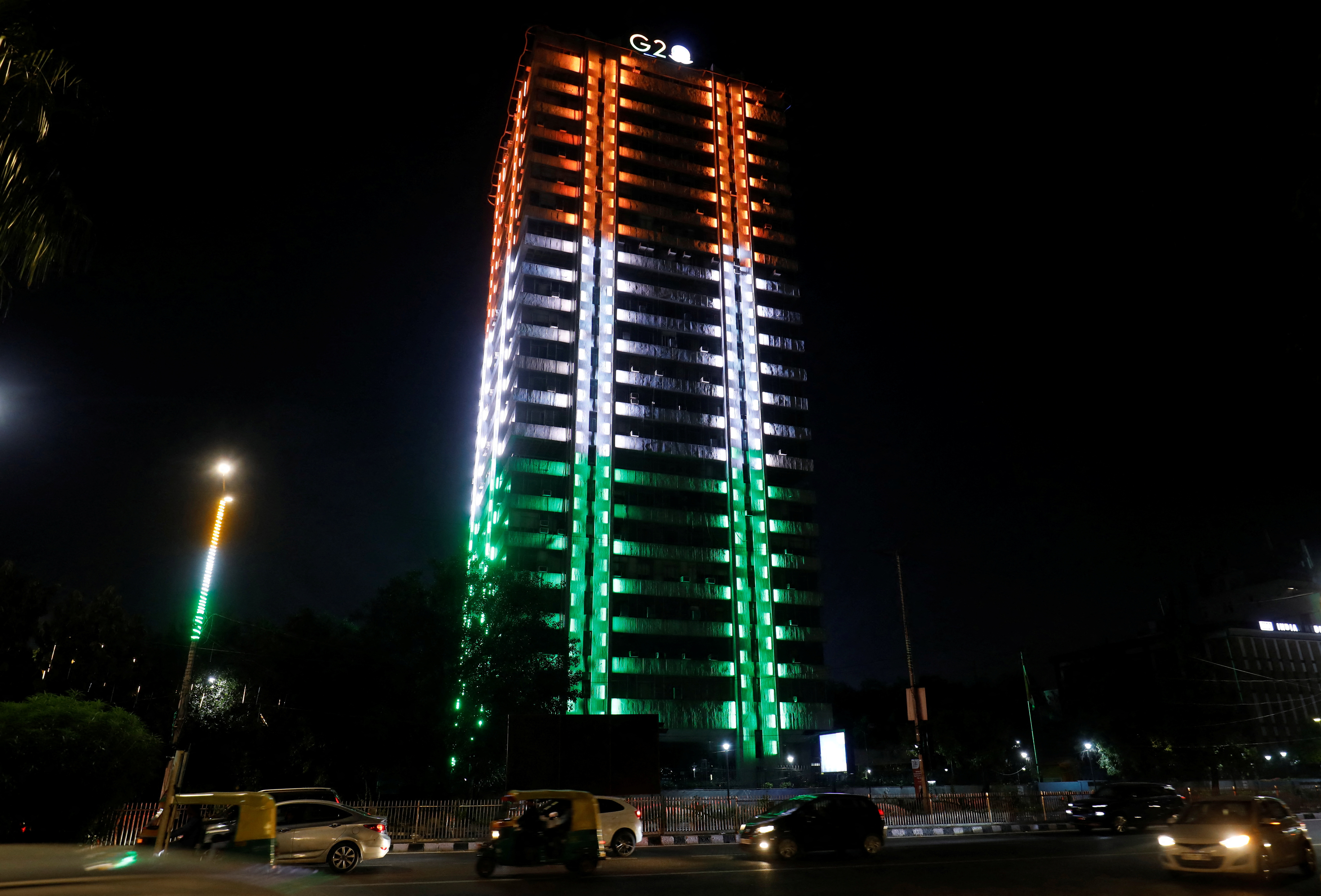 A government building is illuminated in the colours of the India's national flag ahead of the G20 Summit in New Delhi