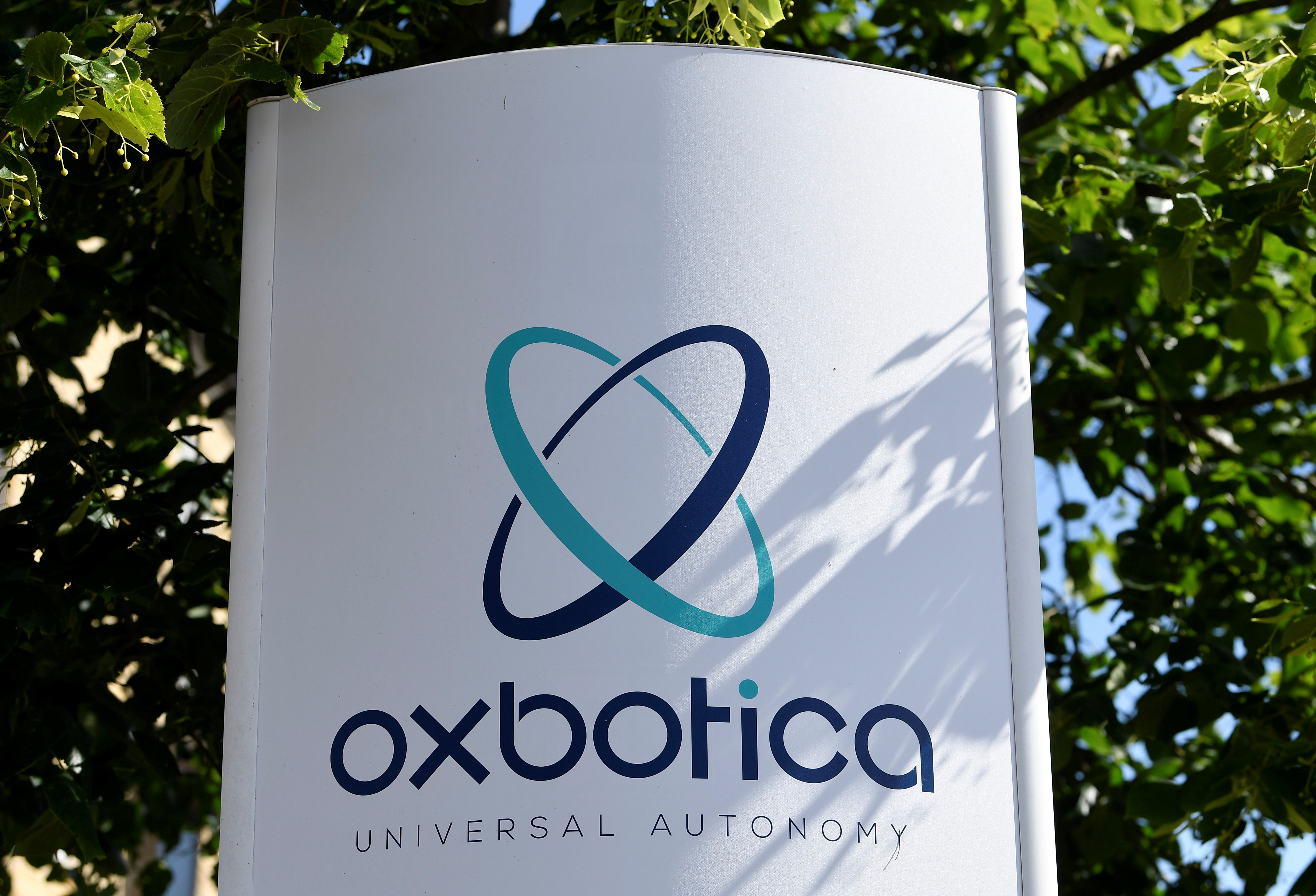 Signage is seen for Oxbotica, an autonomous vehicle technology tech firm, at their company headquarters in Oxford