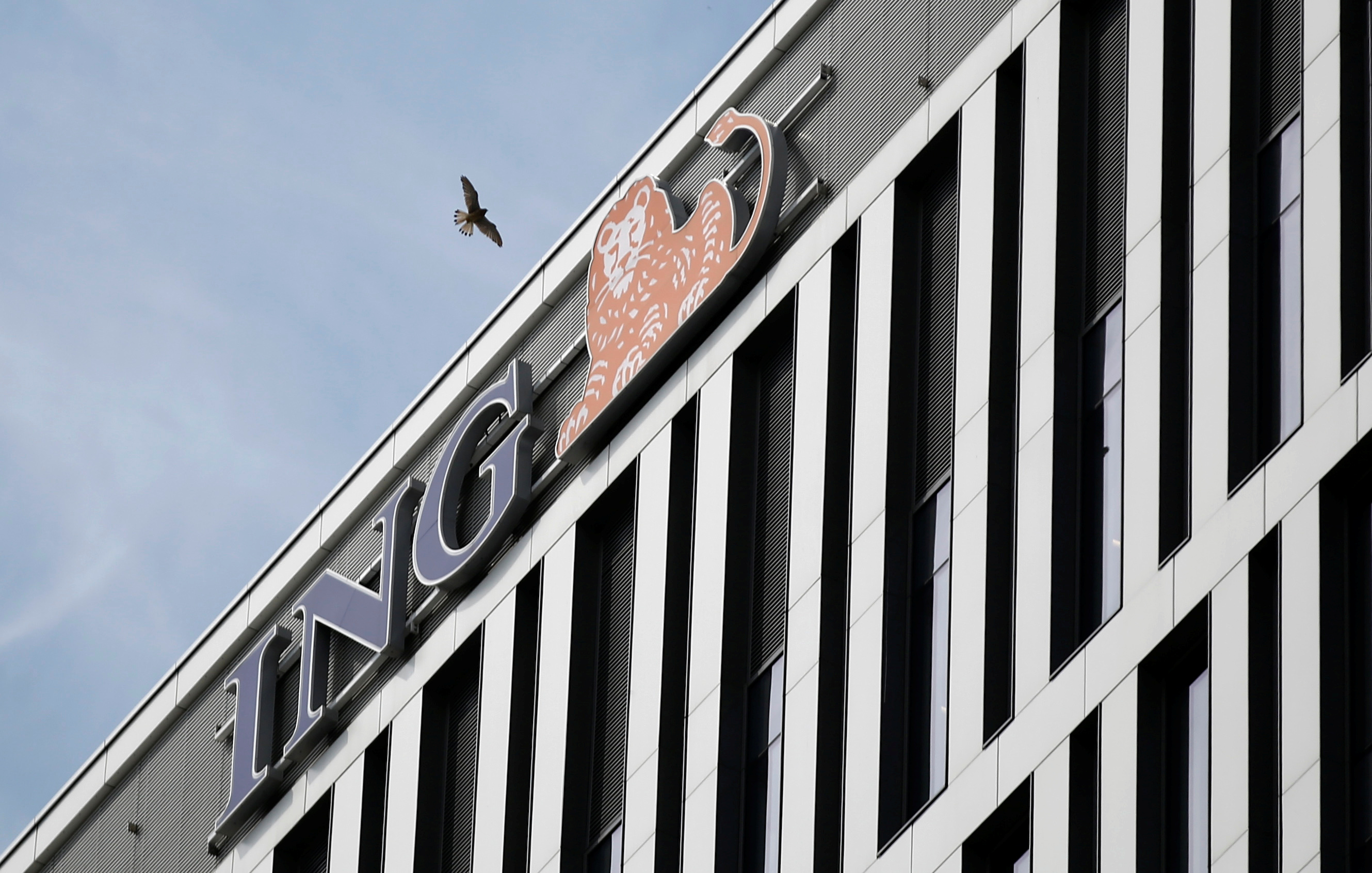 Bird flies near ING Bank Slaski logo seen on their building in Warsaw
