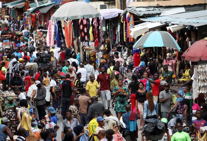 Shoppers crowd a market in Nigeria's commercial capital of Lagos