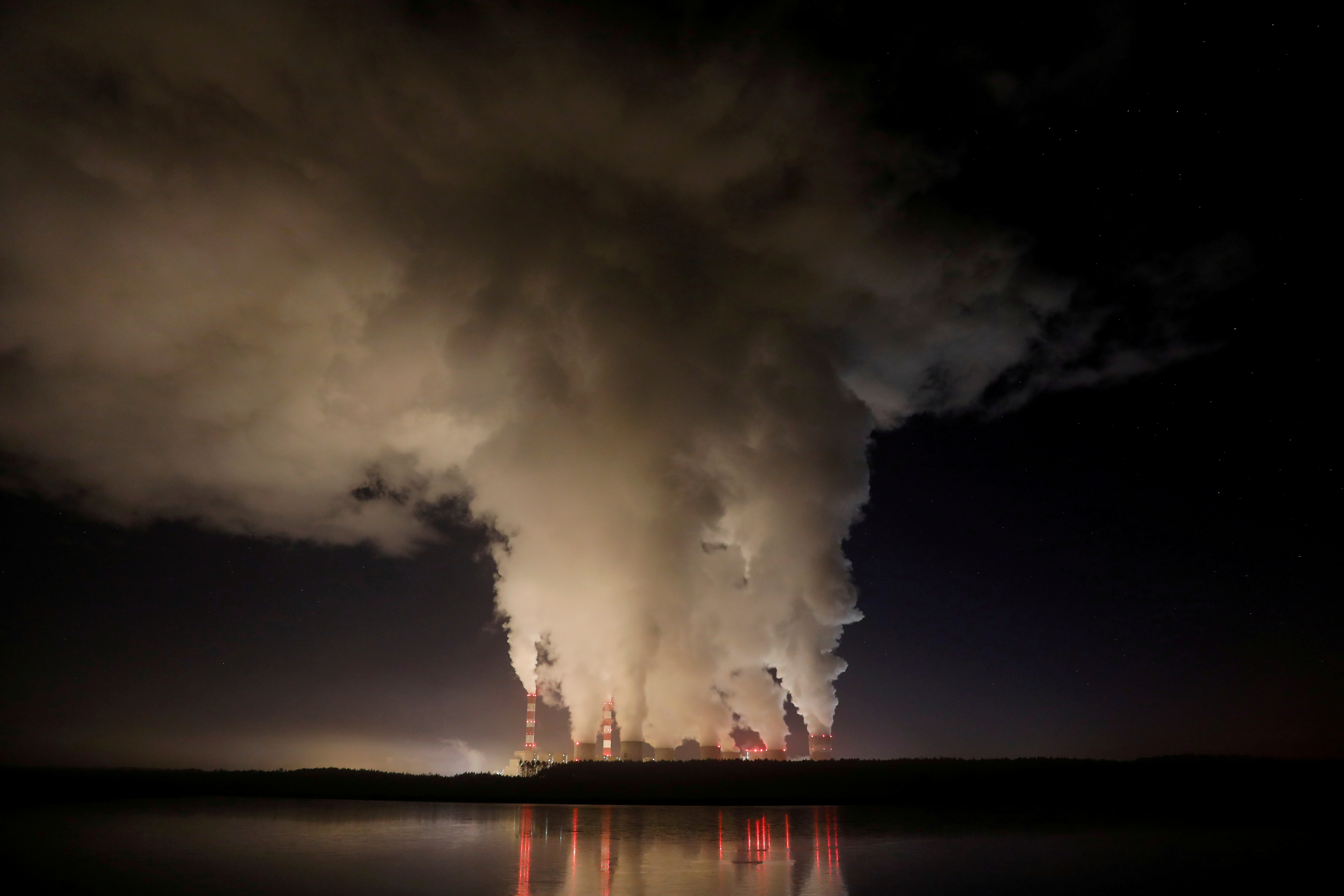Smoke and steam billow from Belchatow Power Station, Europe's largest coal-fired power plant operated by PGE Group, at night near Belchatow, Poland December 5, 2018.  REUTERS/Kacper Pempel/File Photo/File Photo