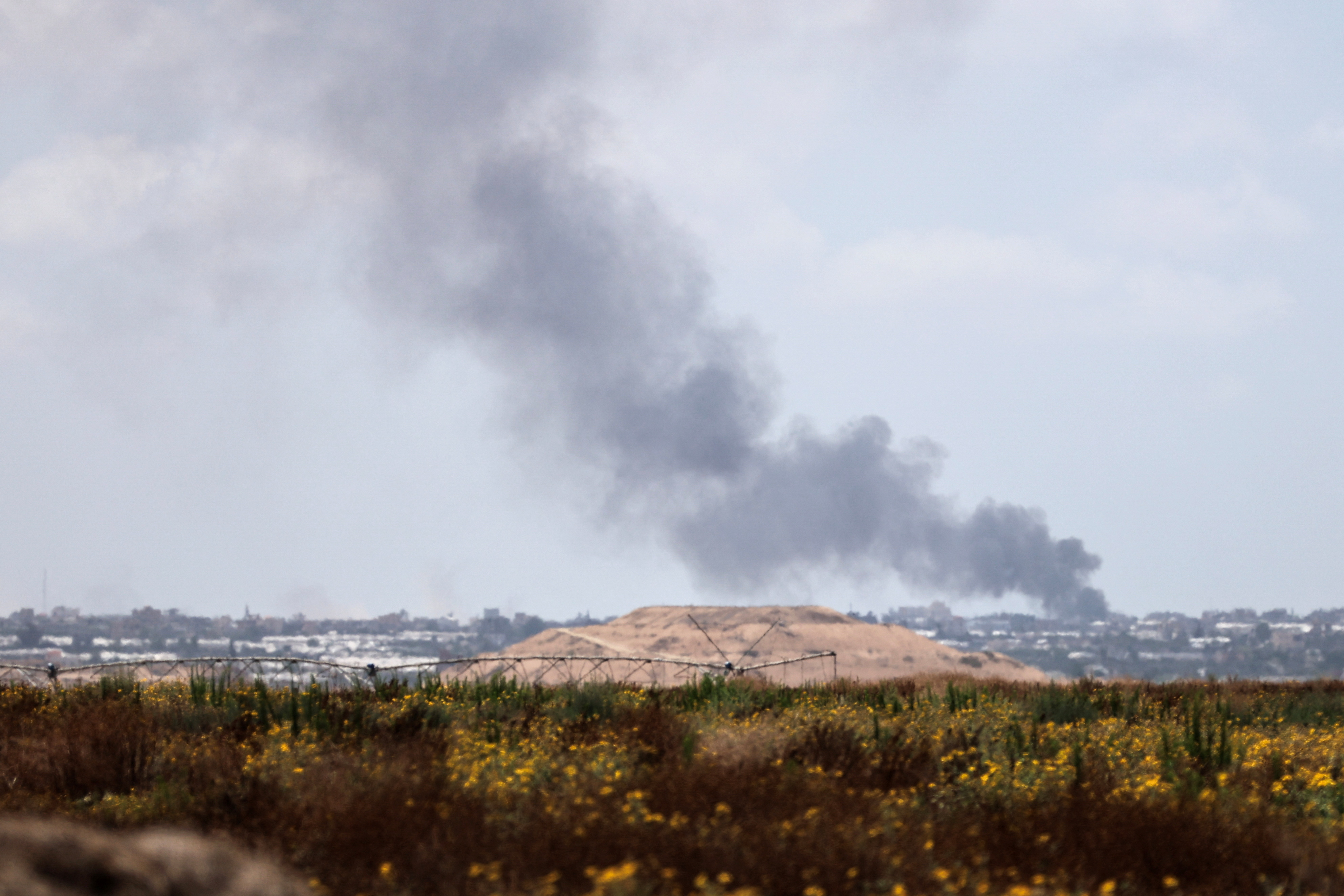 Smoke rises following an airstrike in Gaza, amid the ongoing conflict between Israel and the Palestinian Islamist group Hamas, near the Israel-Gaza border, as seen from Israel