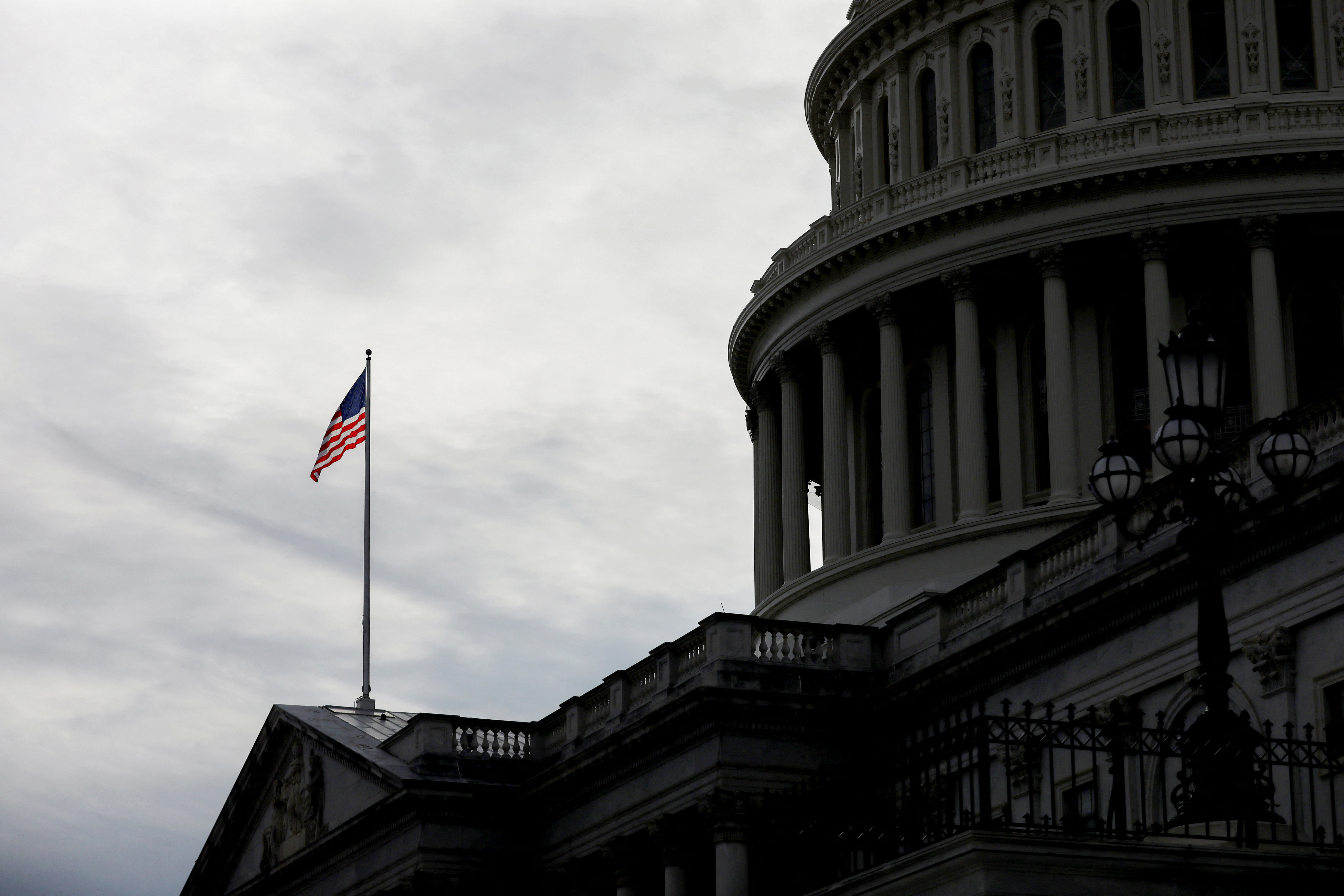 An American flag flies over Capitol Hill in Washington