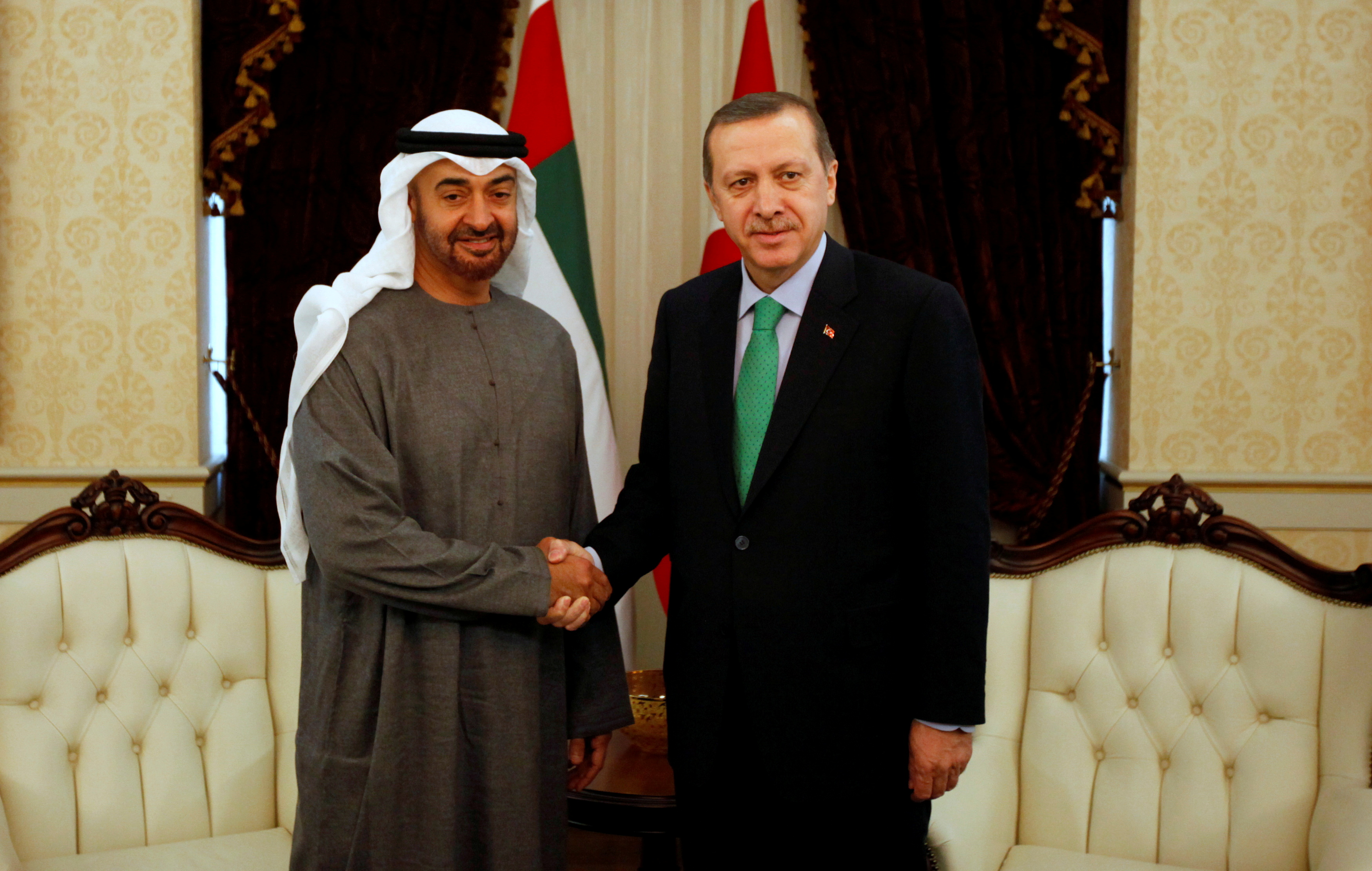 Abu Dhabi's Crown Prince Sheikh Mohammed shakes hands with Turkey's PM Erdogan before a 2012 meeting in Ankara