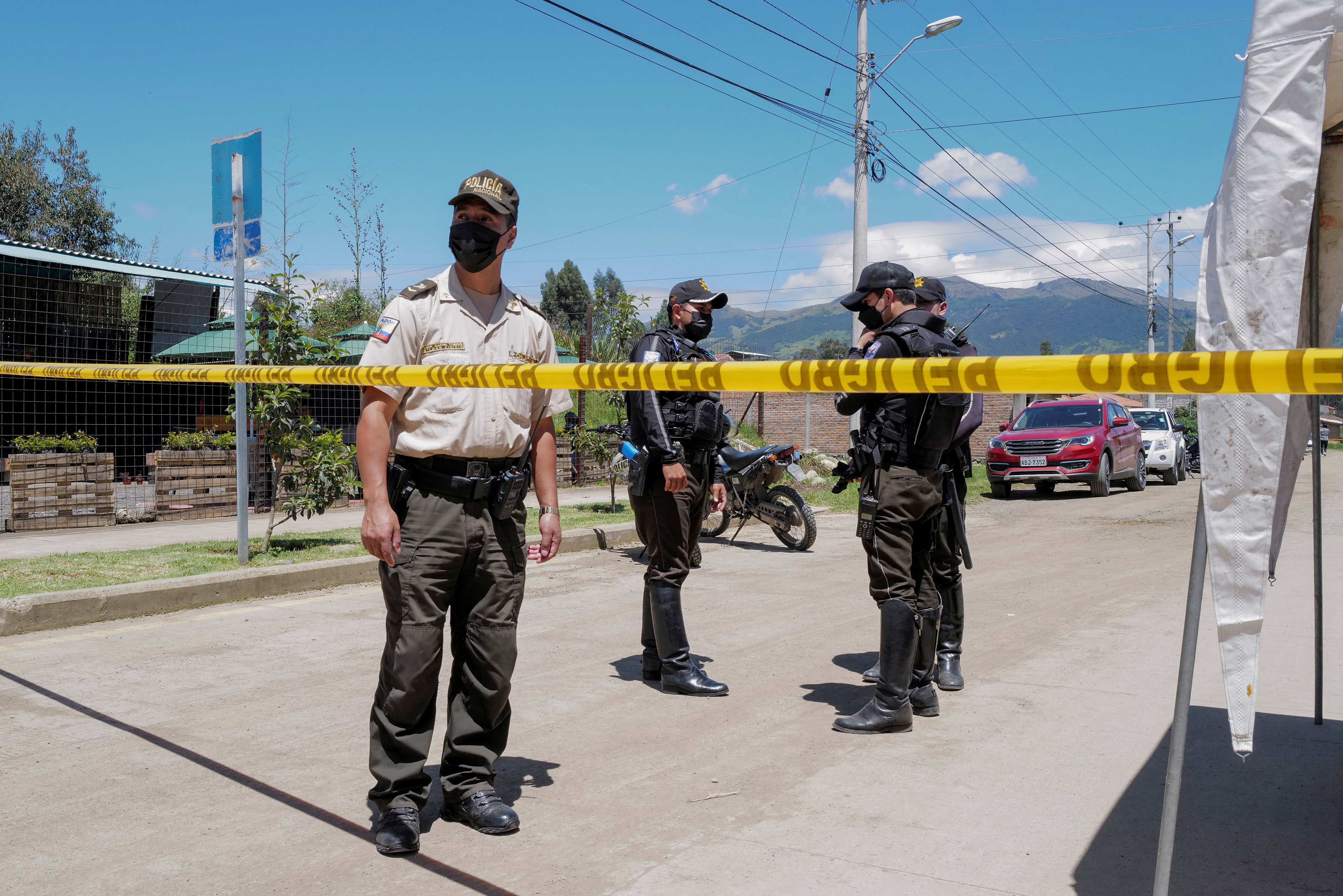 Family members gather outside morgue after deadly Ecuadoran prison riot, in Cuenca