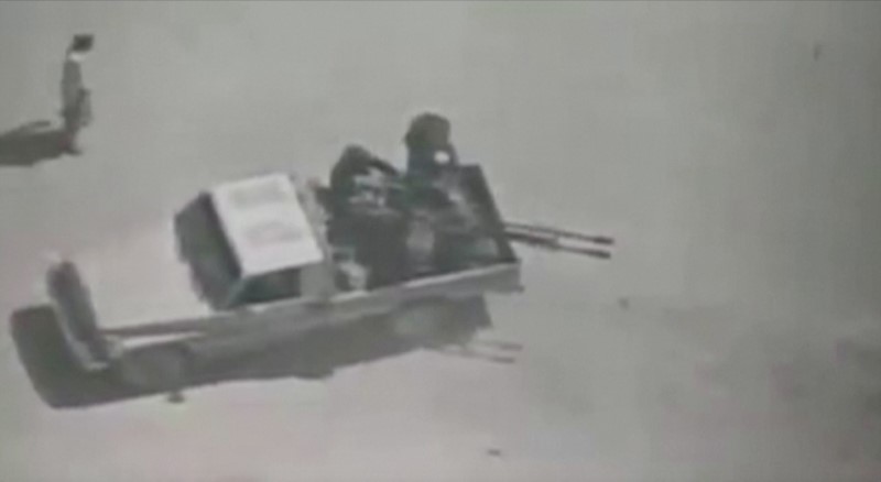 People believed to be militants are seen on a pickup truck with a gun in Afghanistan, in this still image obtained from a video posted by the Afghan Defence Ministry on its Facebook page. Reuters could not independently verify the locations nor the date of the footage. Courtesy of  AFGHAN DEFENCE MINISTRY (MOD) / via REUTERS 