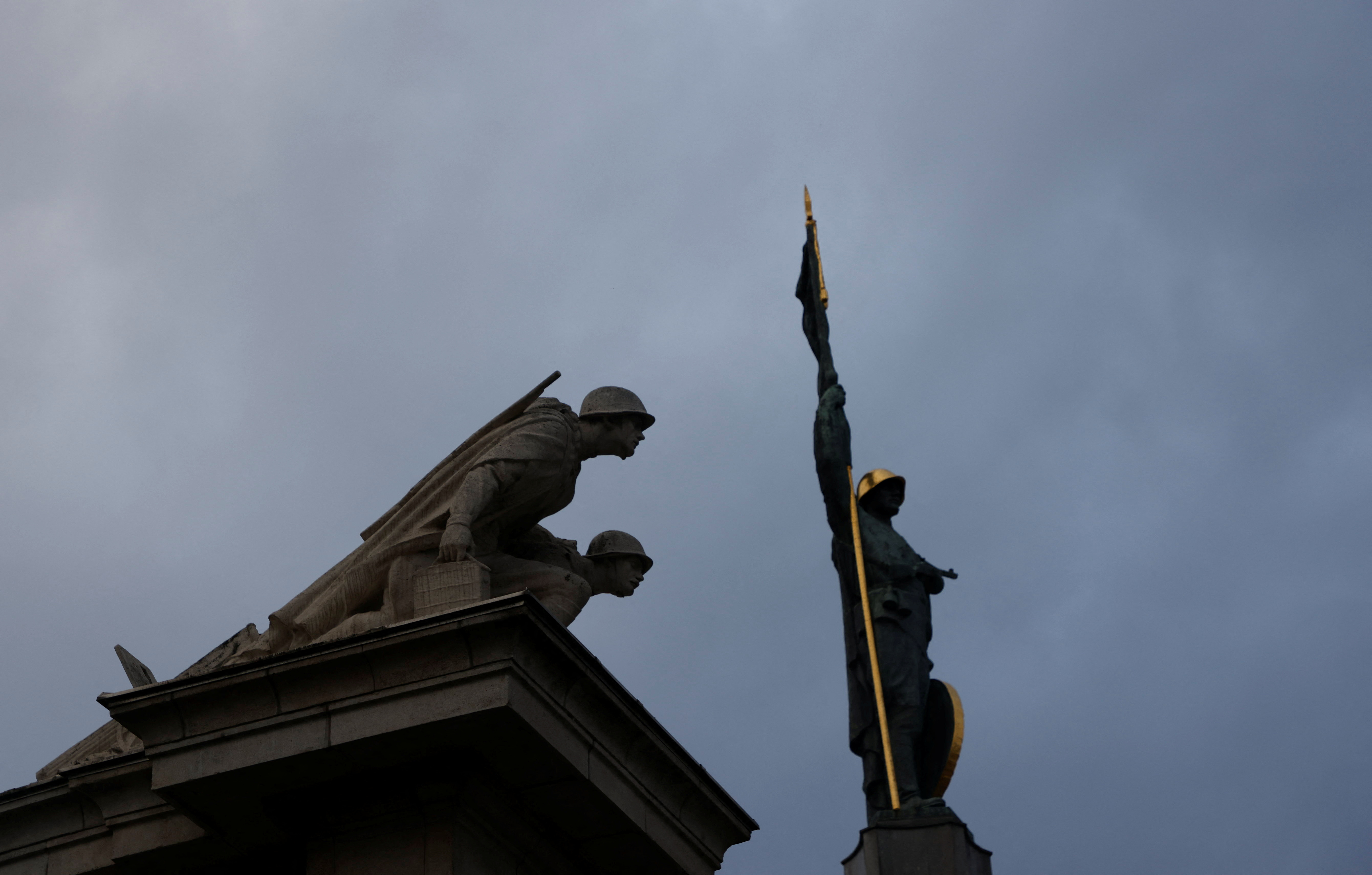 Three figures of The Soviet War Memorial are pictured in Vienna