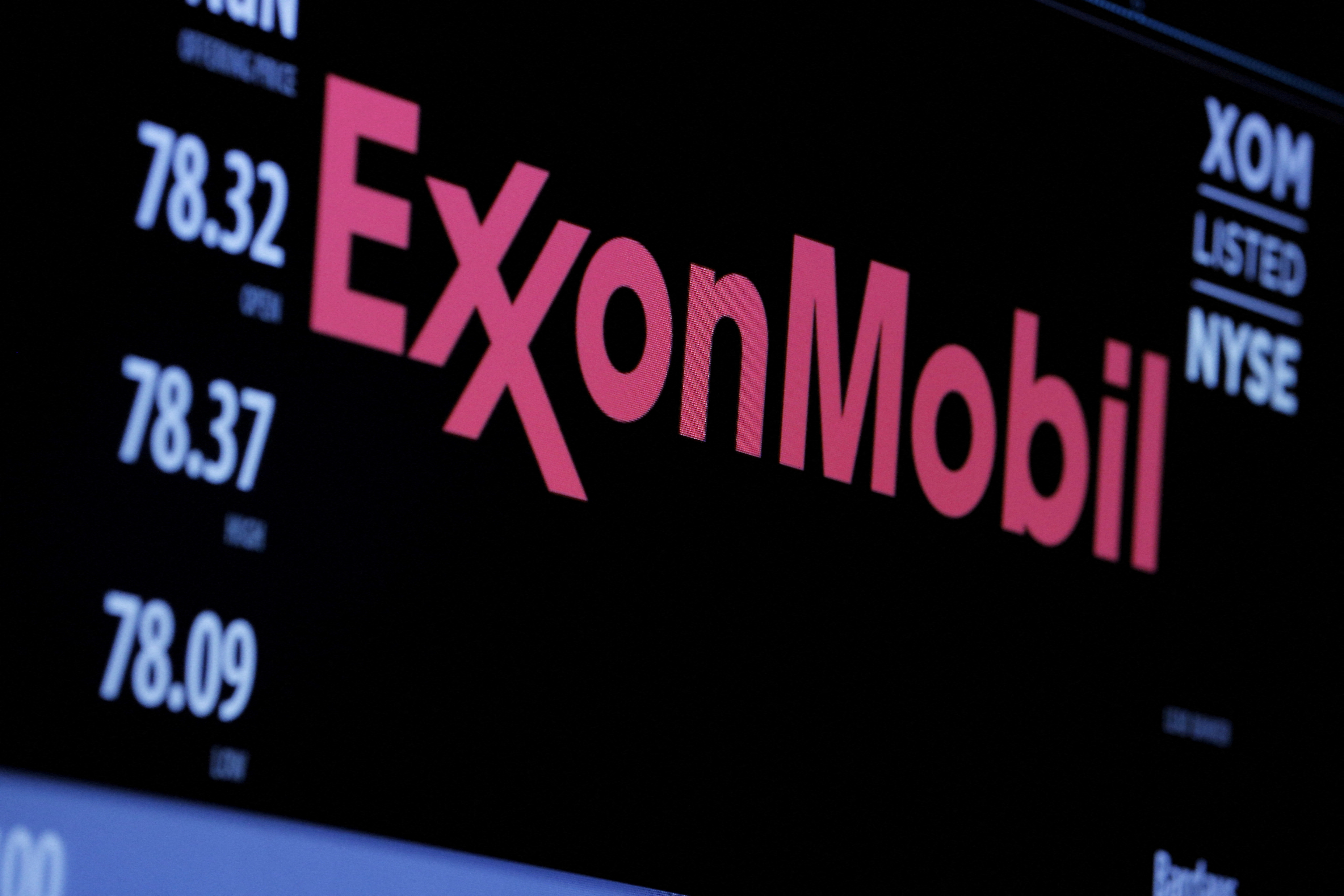 The ExxonMobil logo appears on a screen above the floor of the New York Stock Exchange in New York