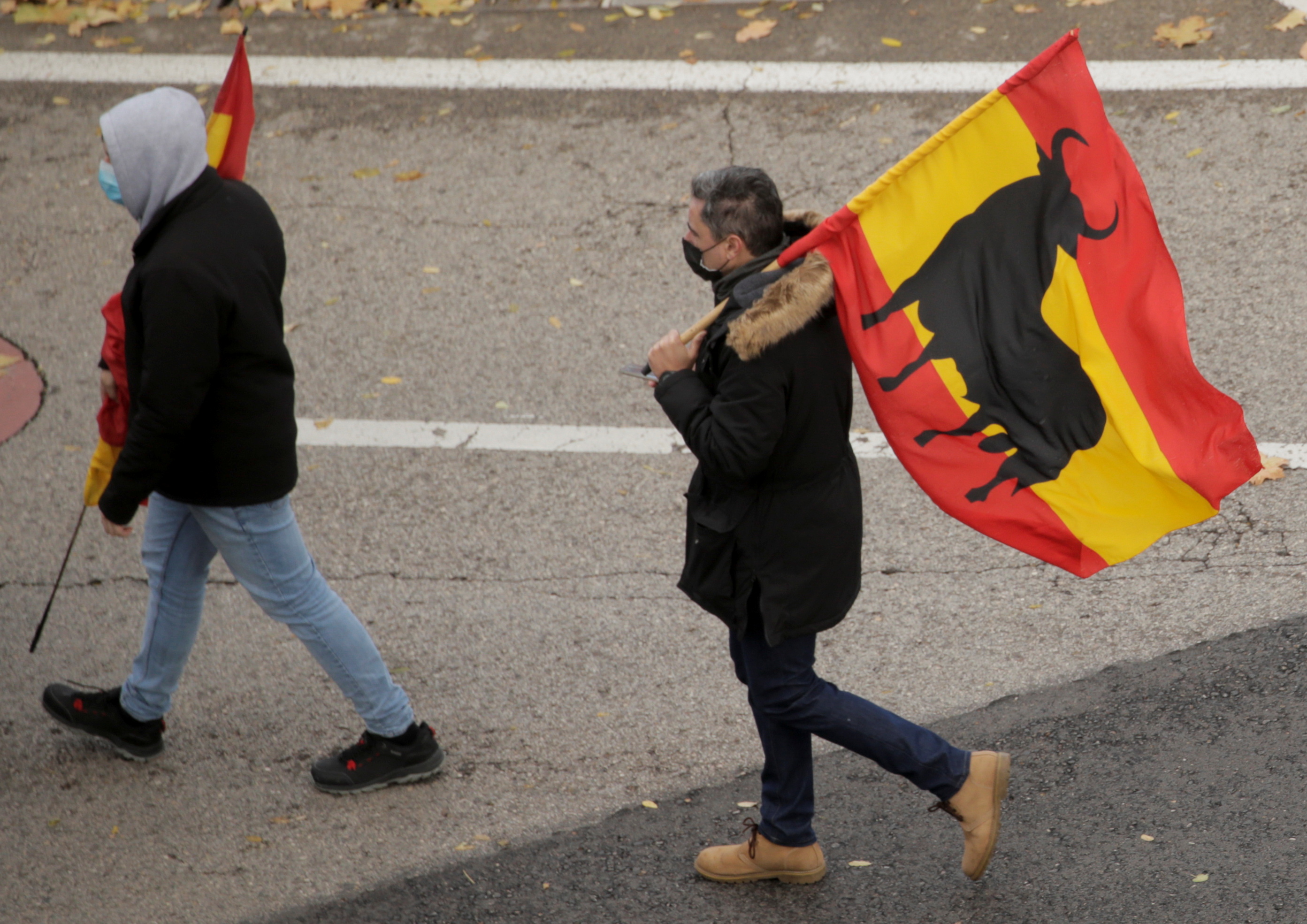 People carry flags during a protest against the proposed changes to anti-terrorism and gagging laws, which police officers say will undermine their authority and jeopardise the safety of citizens, in Madrid, Spain, November 27, 2021. REUTERS/Javier Barbancho