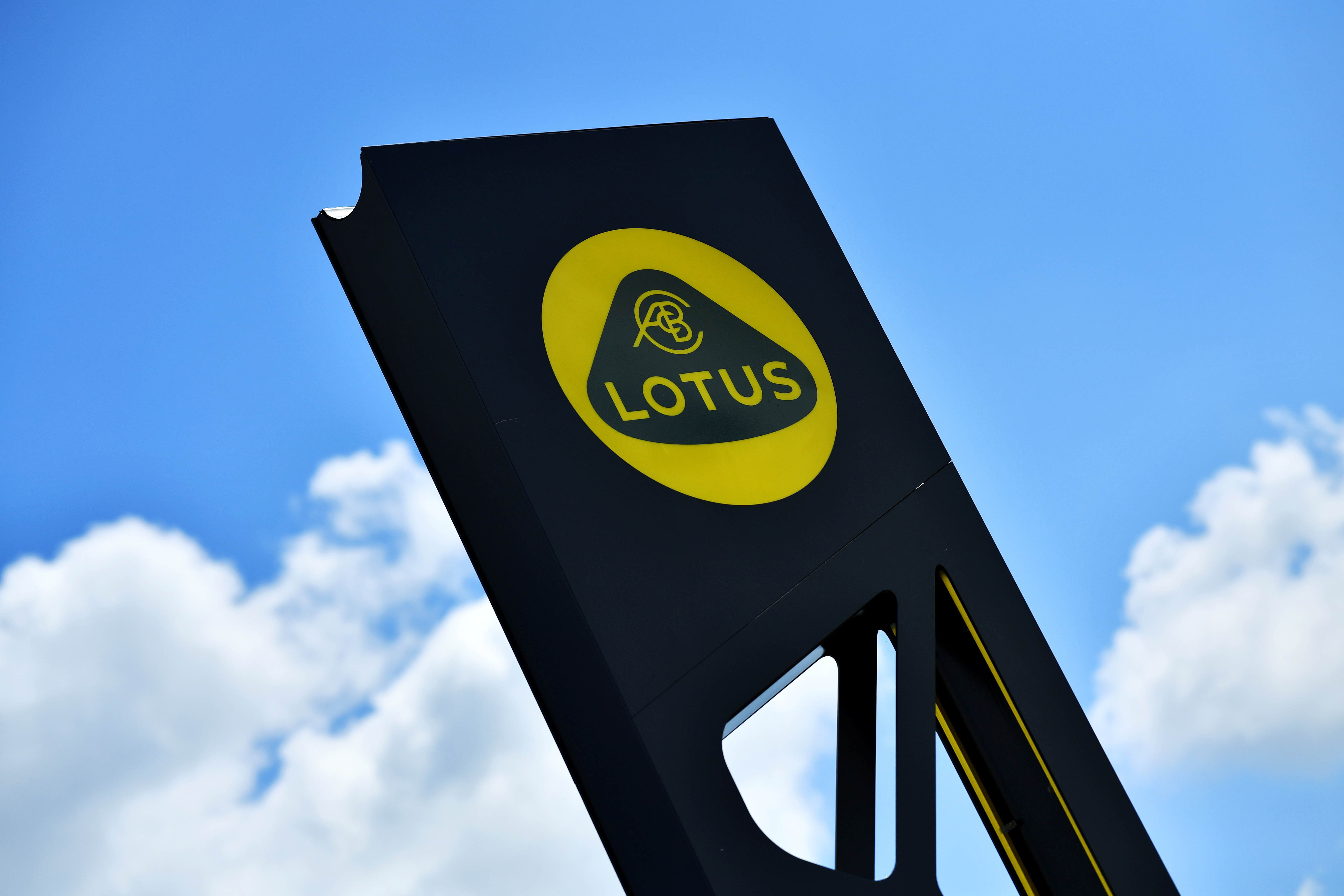 A Lotus sign is seen at the car plant headquarters in Hethel