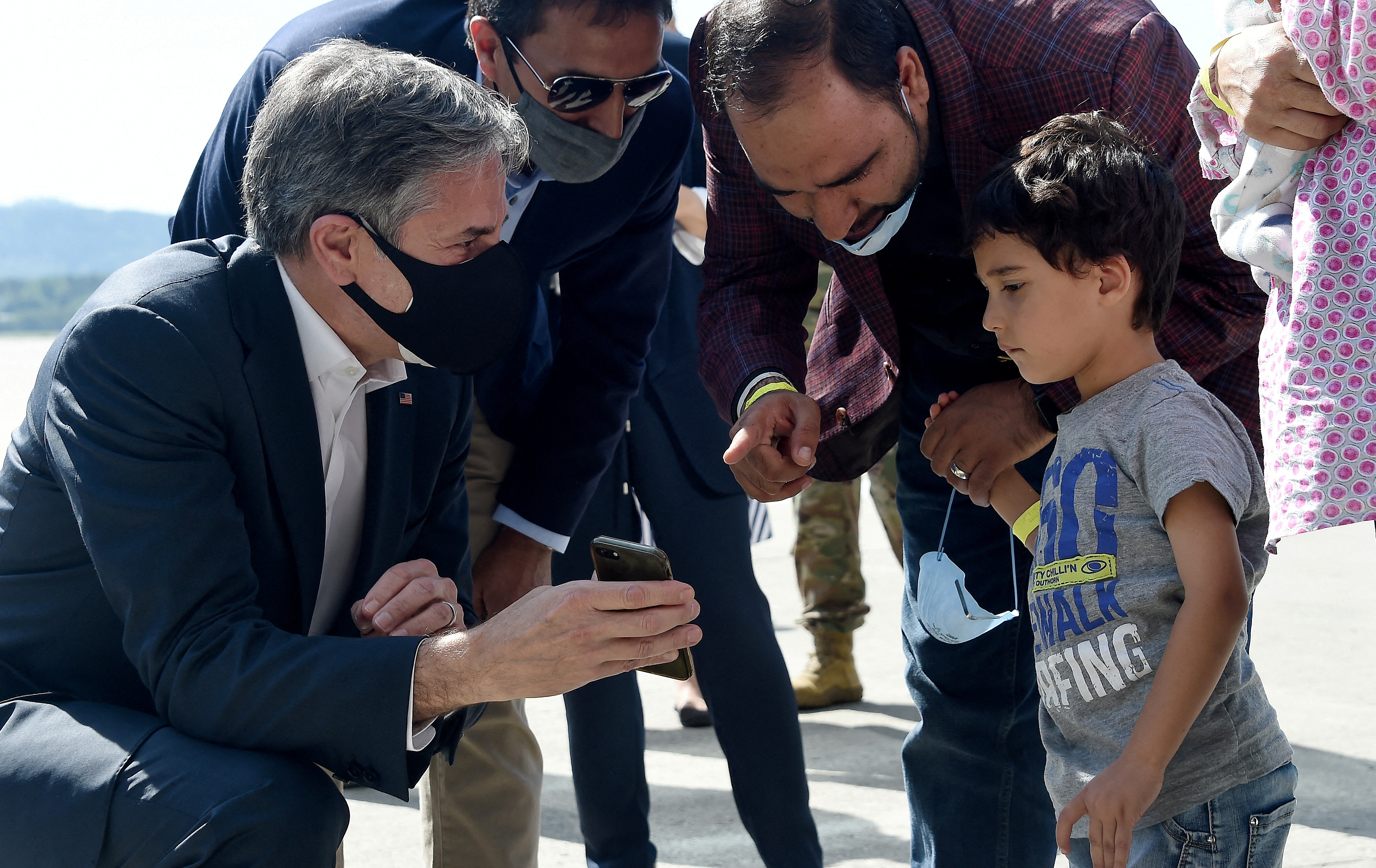 U.S Secretary of State Antony Blinken meets with an Afghan refugee family outside Hangar 5 for evacuation operations at Ramstein Air Base in Germany