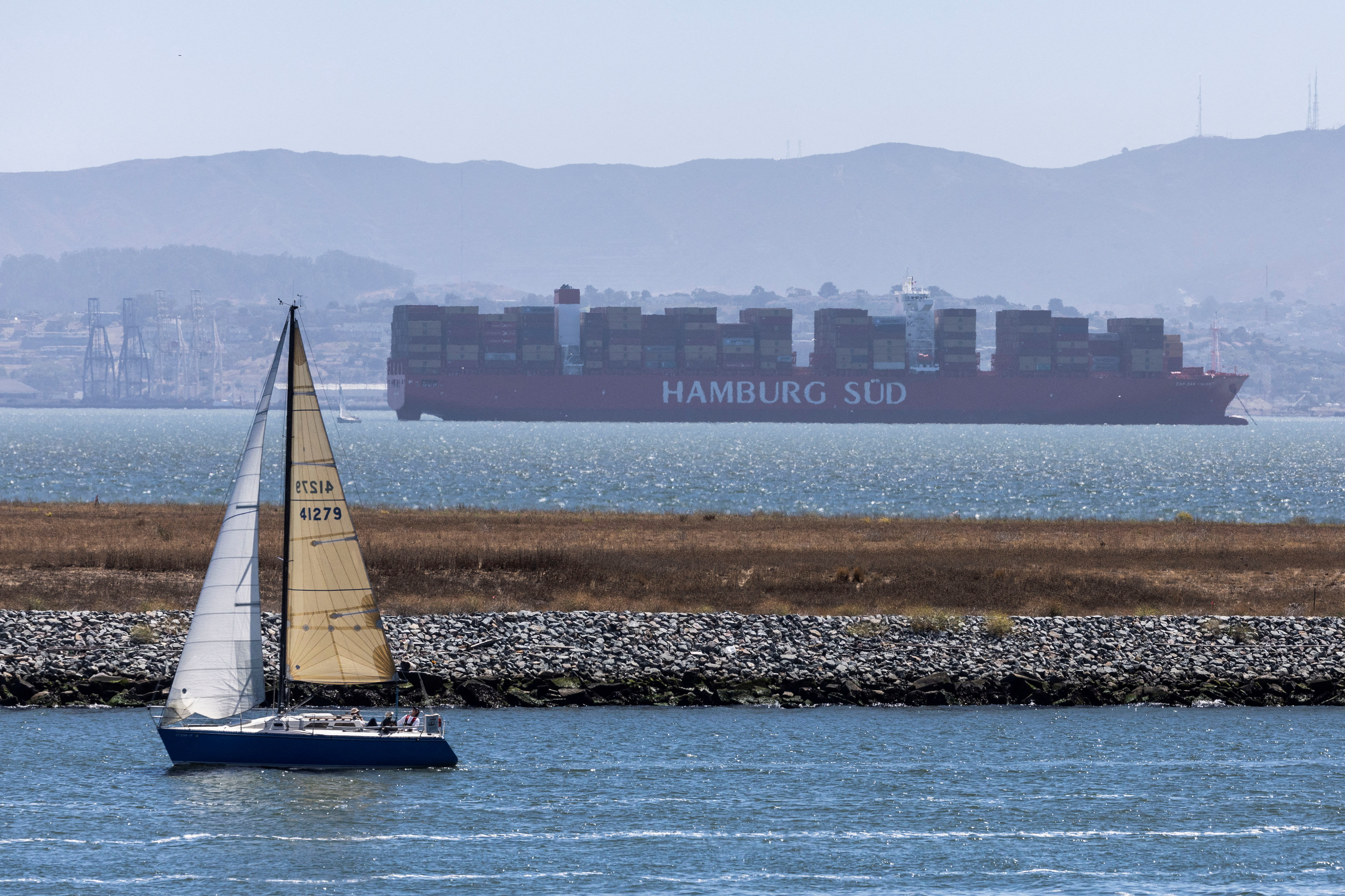 A cargo ship is seen near the port of Oakland, California