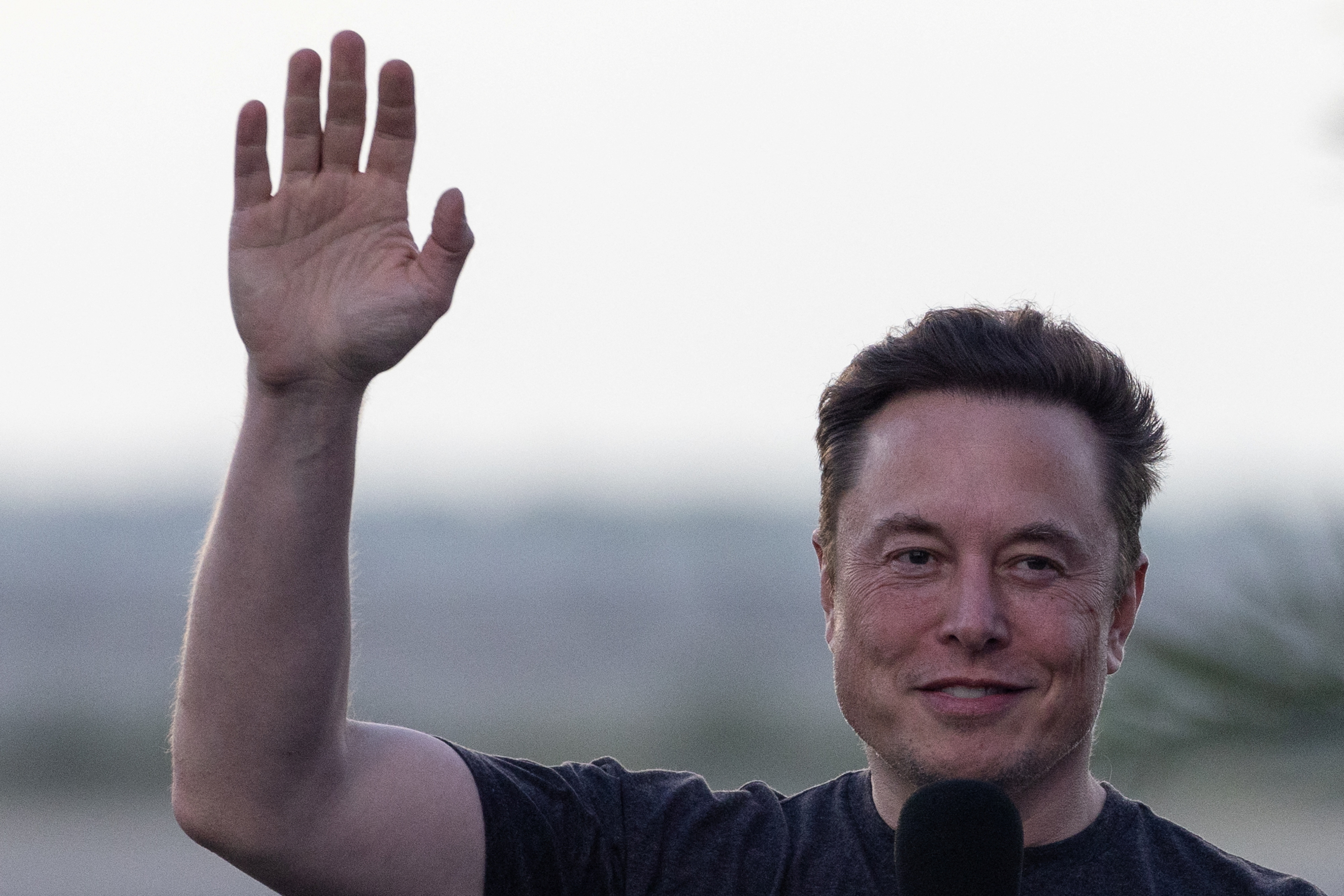 Musk waves during news conference at SpaceX Starbase in Brownsville, Texas