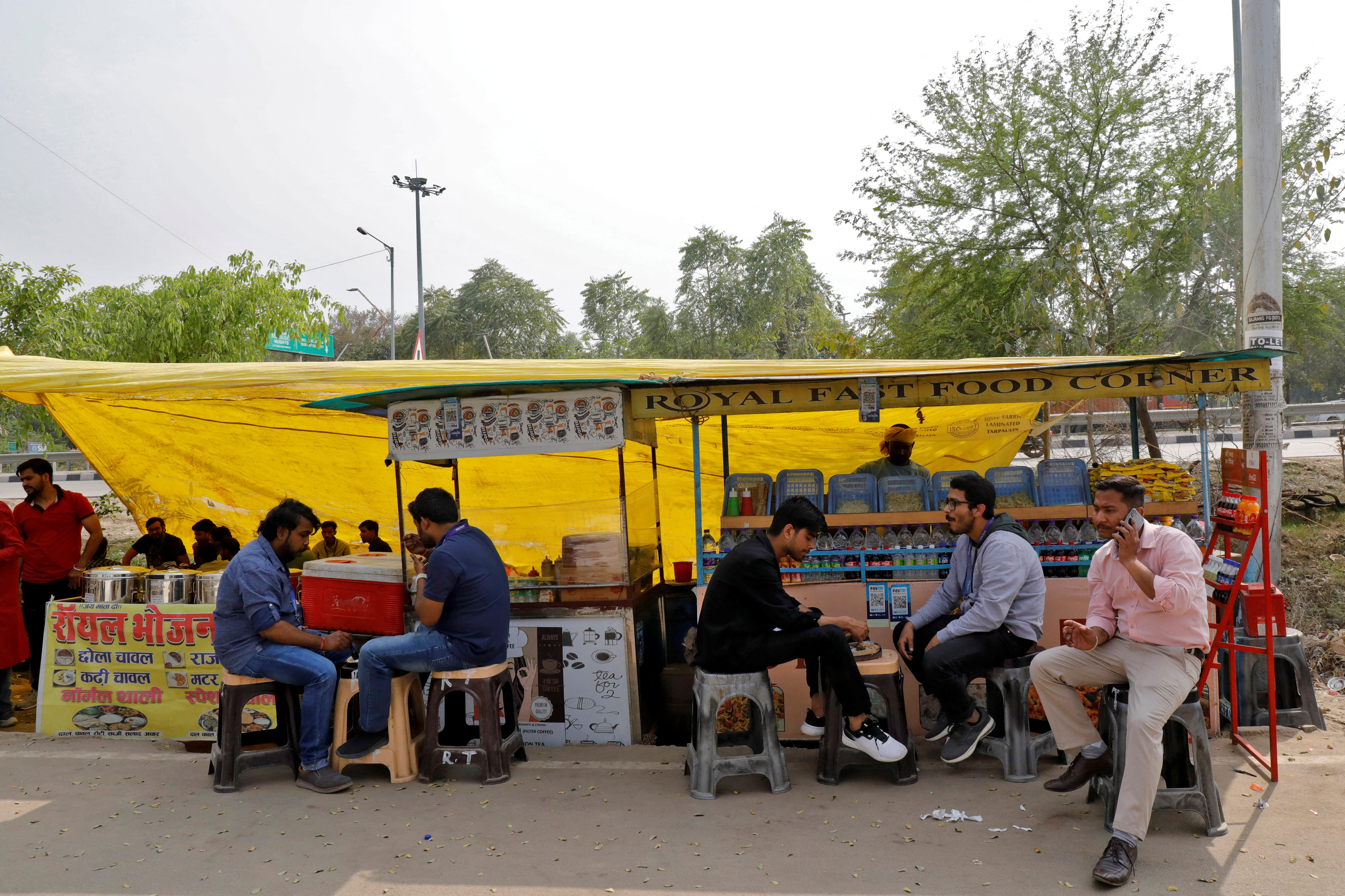 Employees of HCLTech have their meals at the roadside eateries outside their office on outskirts of Lucknow