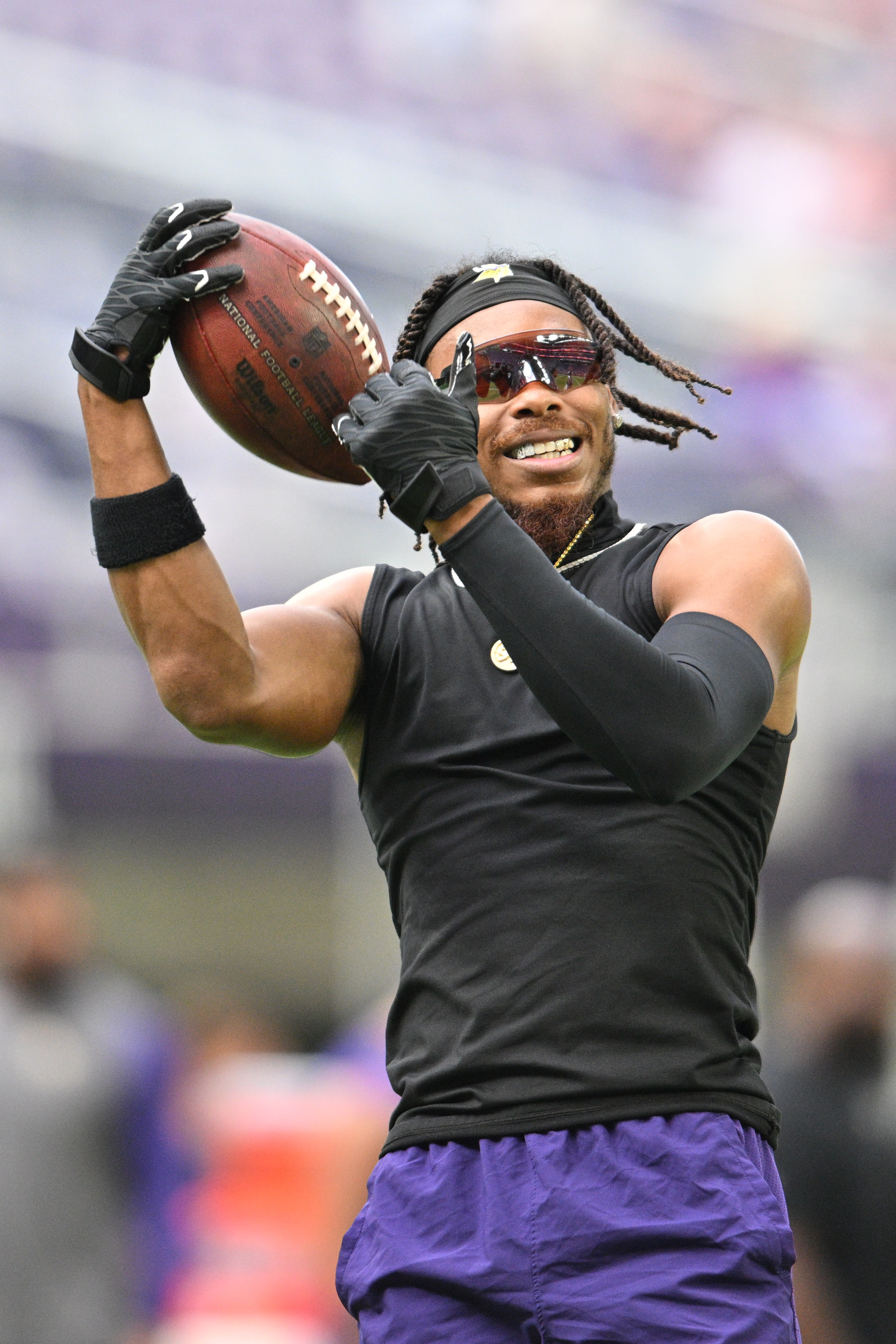 Minnesota Vikings wide receiver Justin Jefferson (18) talks with Arizona  Cardinals players after a NFL preseason