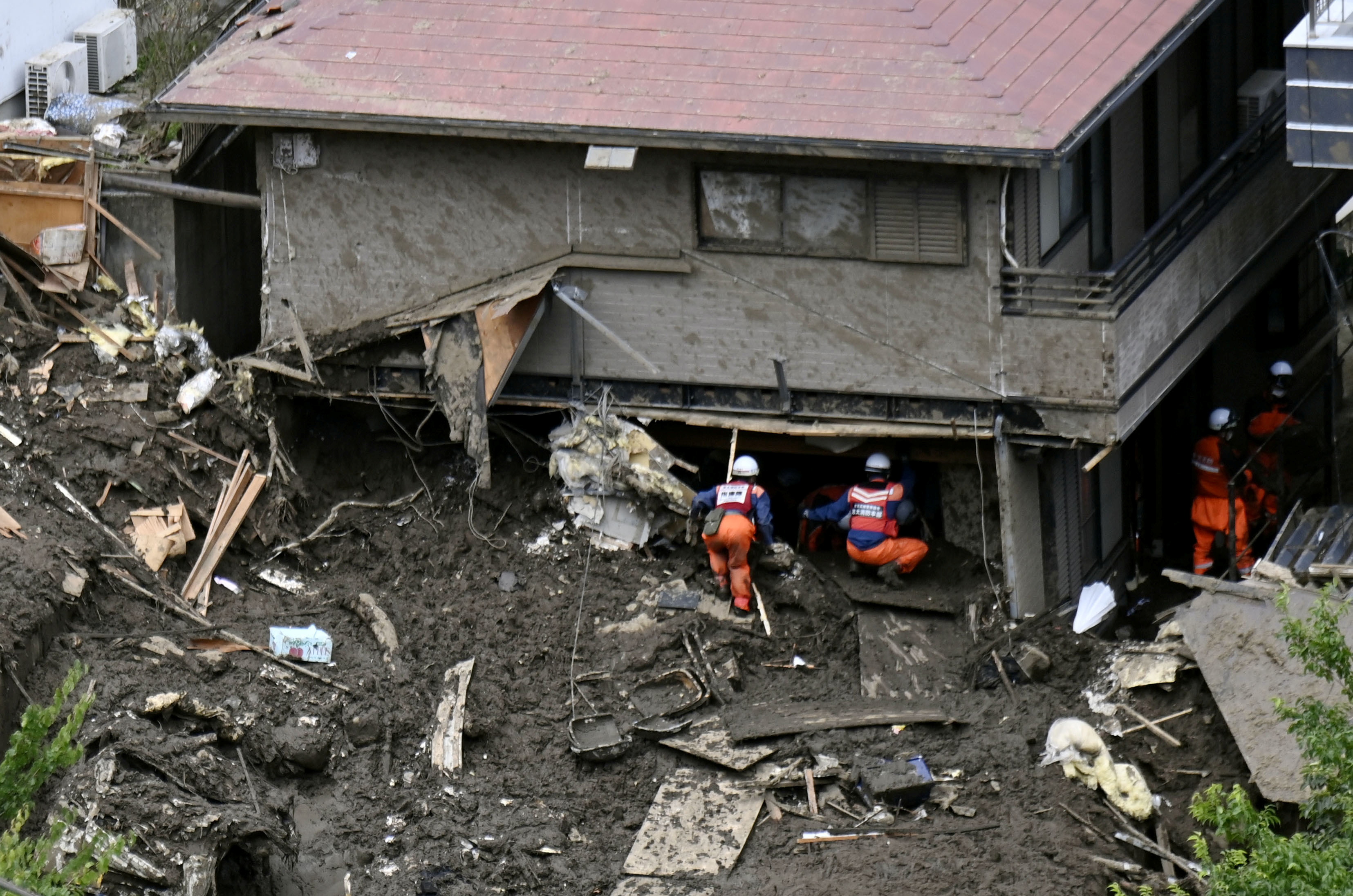 Rescue and search operation continues at the site of a mudslide which was caused by heavy rain at Izusan district in Atami, Japan July 7, 2021. Kyodo/via REUTERS 