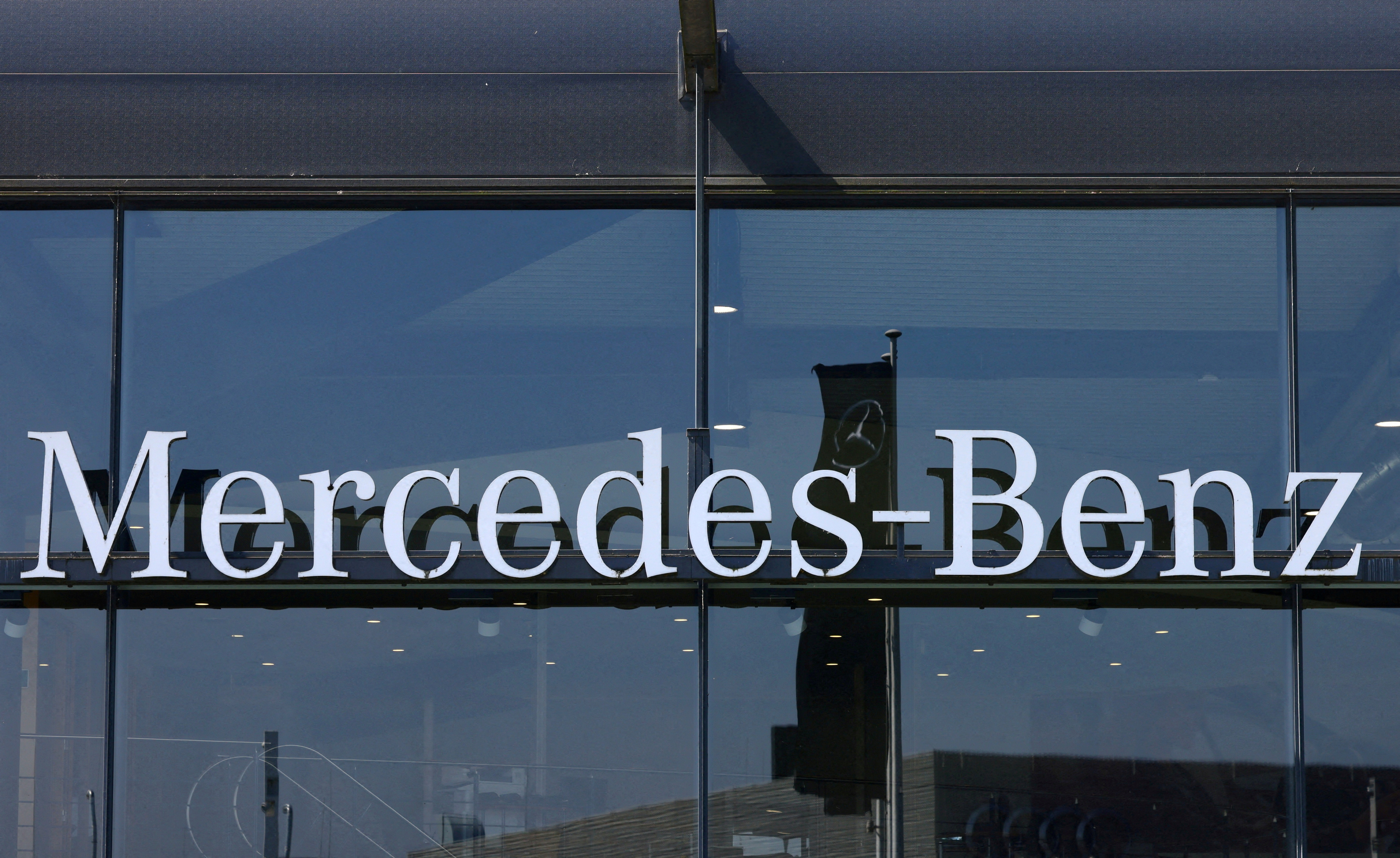 The logo of Mercedes-Benz is seen outside a Mercedes-Benz car dealer in Brussels