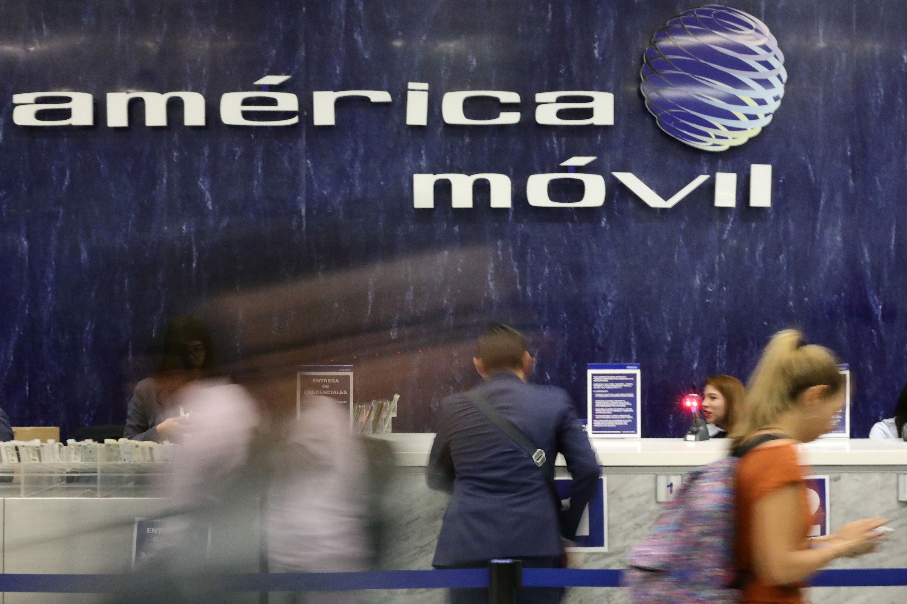 The logo of America Movil is pictured on the wall of a reception area in the company's corporate offices in Mexico City