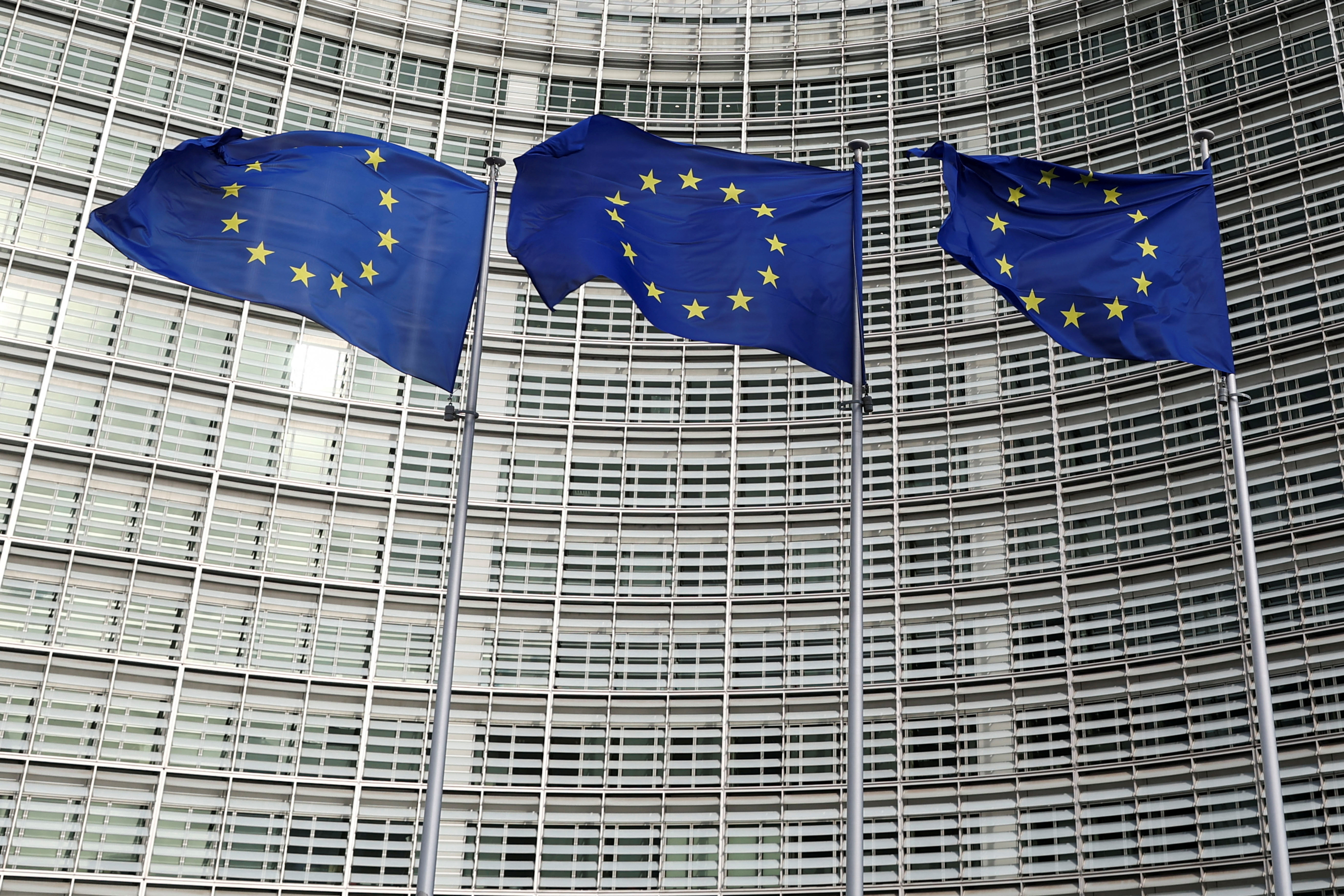 EU flags fly outside the European Commission in Brussels