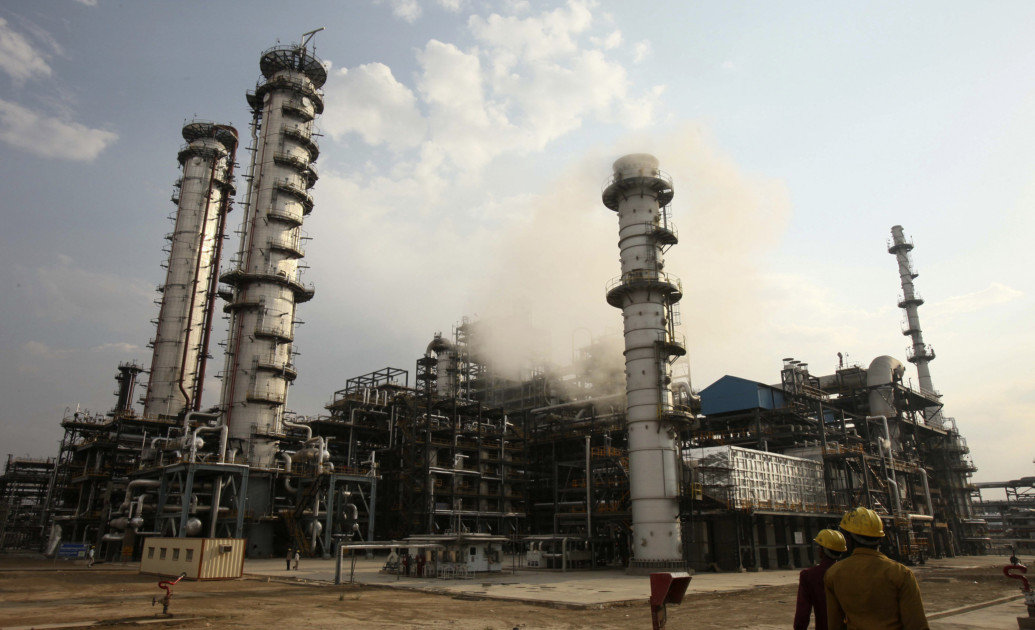 Workers walk inside the complex of Guru Gobind Singh oil refinery near Bhatinda in the northern Indian state of Punjab