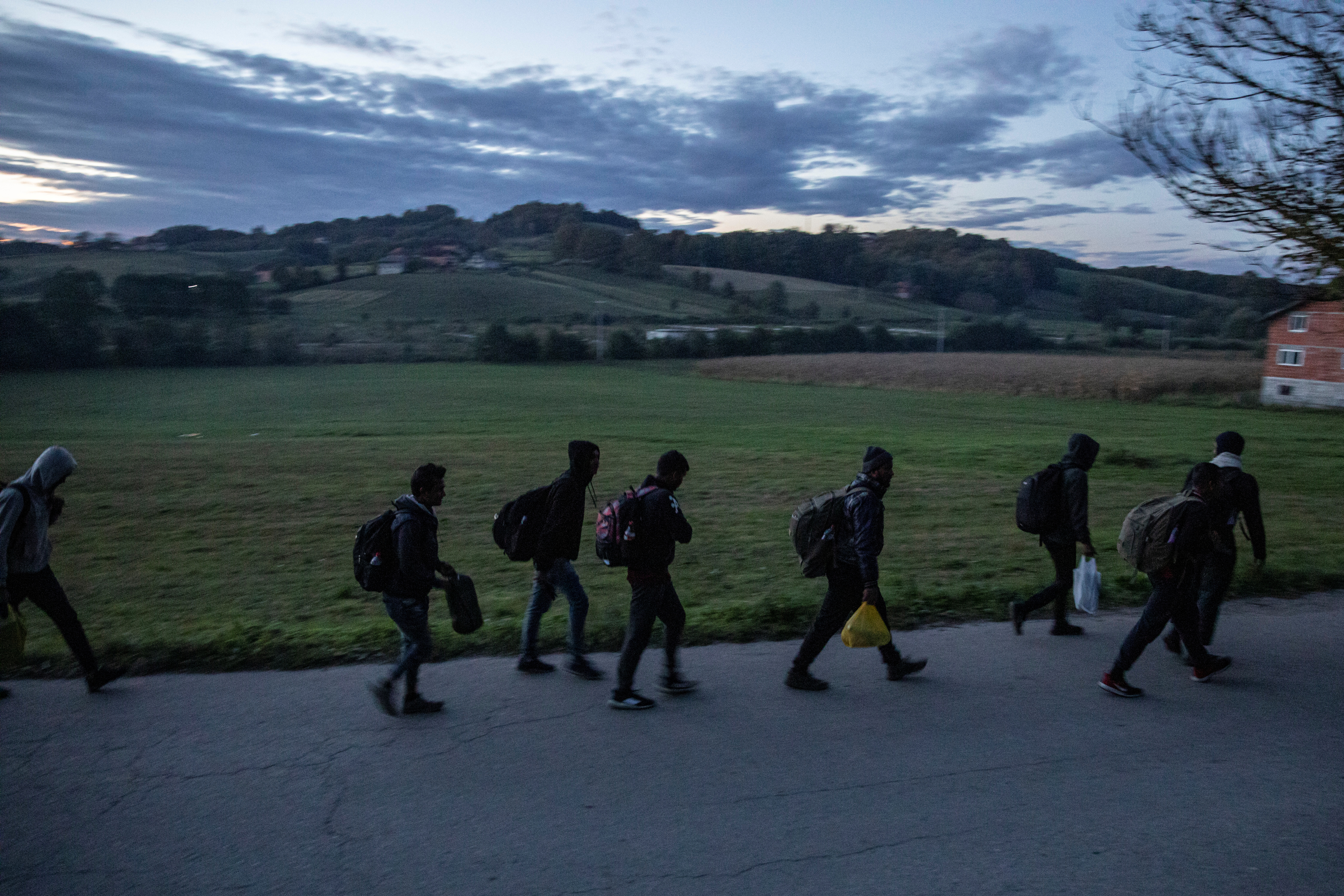 Migrants gather before trying to cross the Bosnia-Croatia border near Velika Kladusa