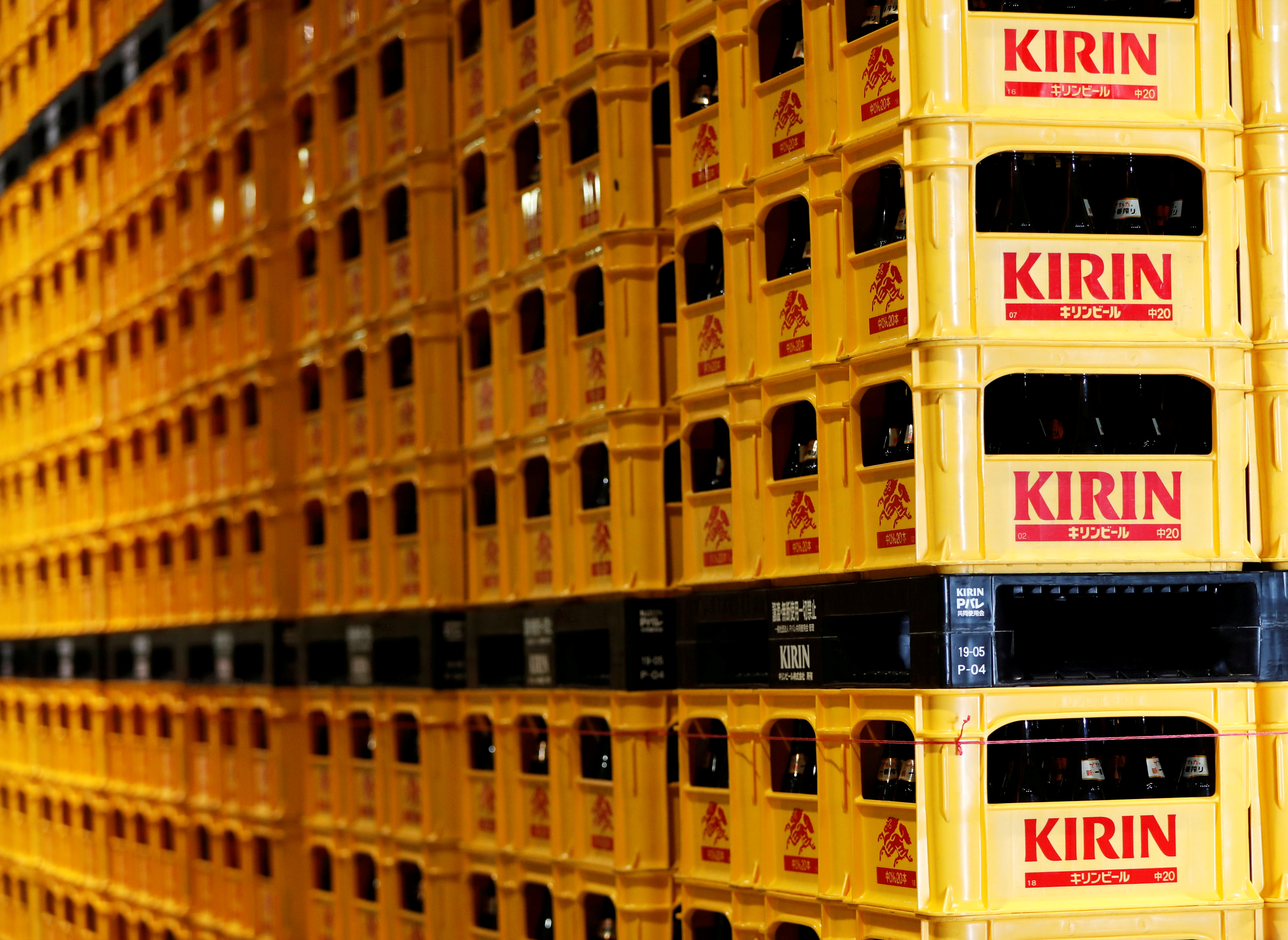 Plastic cartons containing Kirin brand beer bottles are seen at Kirin Brewery Co. Yokohama Factory in Yokohama