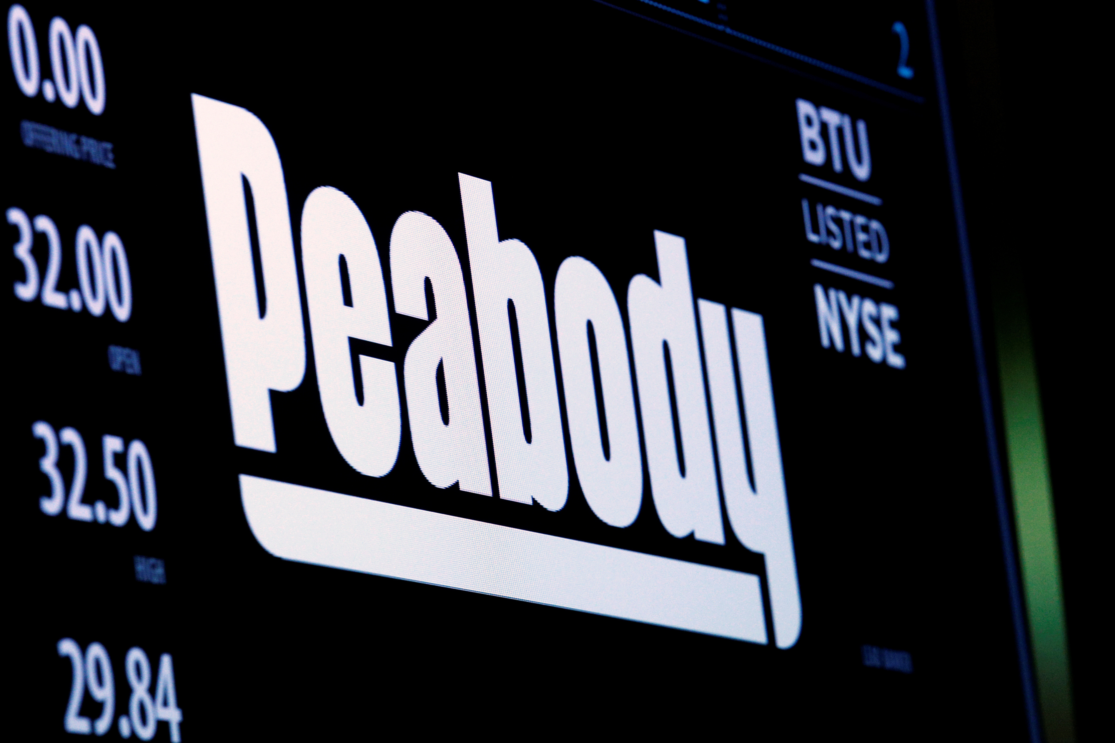 The logo and trading information for U.S. coal miner Peabody Energy Corp. are displayed on a screen on the floor of the NYSE, New York