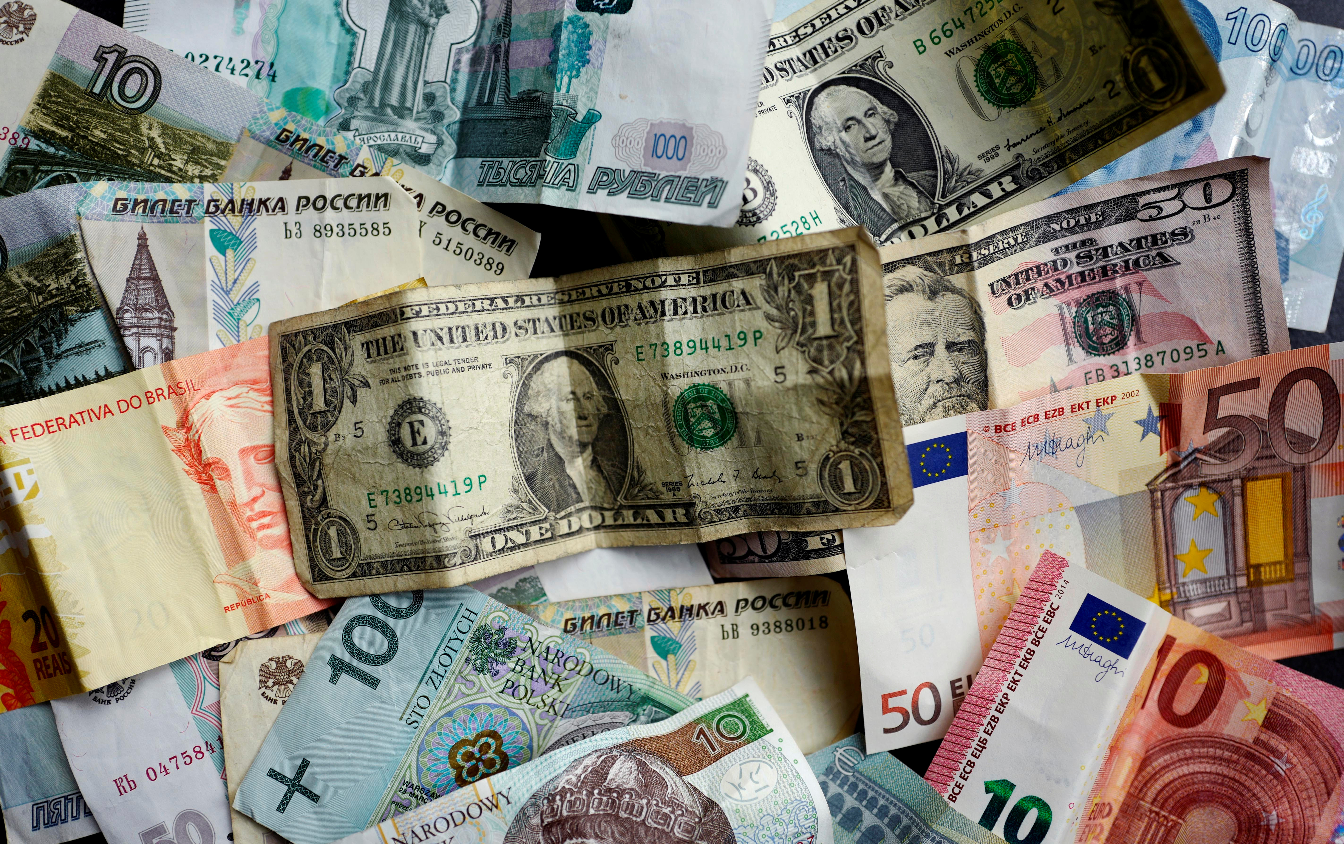Bank notes of different currencies are photographed in Frankfurt, Germany, in this illustration picture