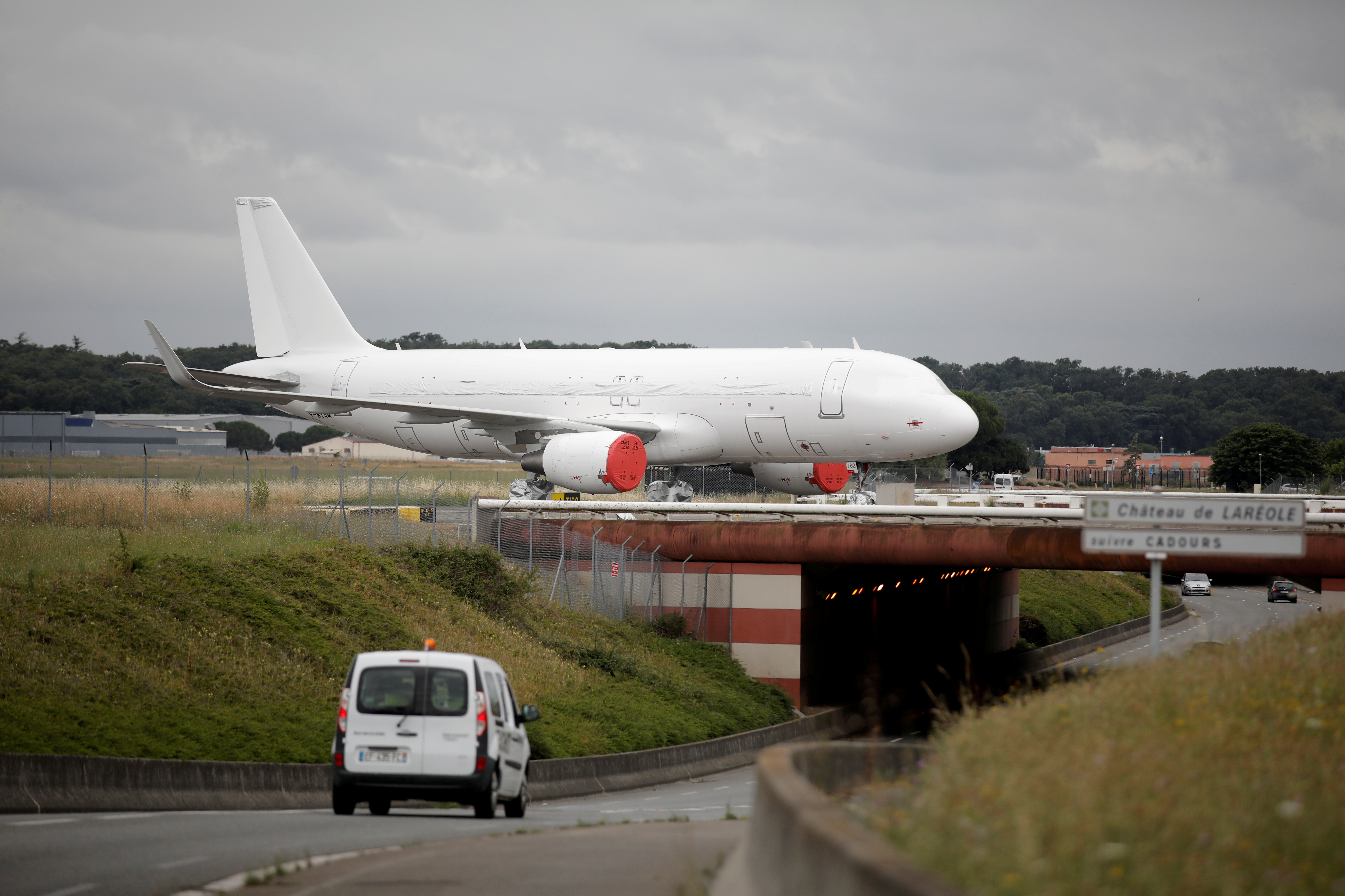 An unmarked A320-214SL Airbus plane is seen on the tarmac at the Airbus factory in Blagnac