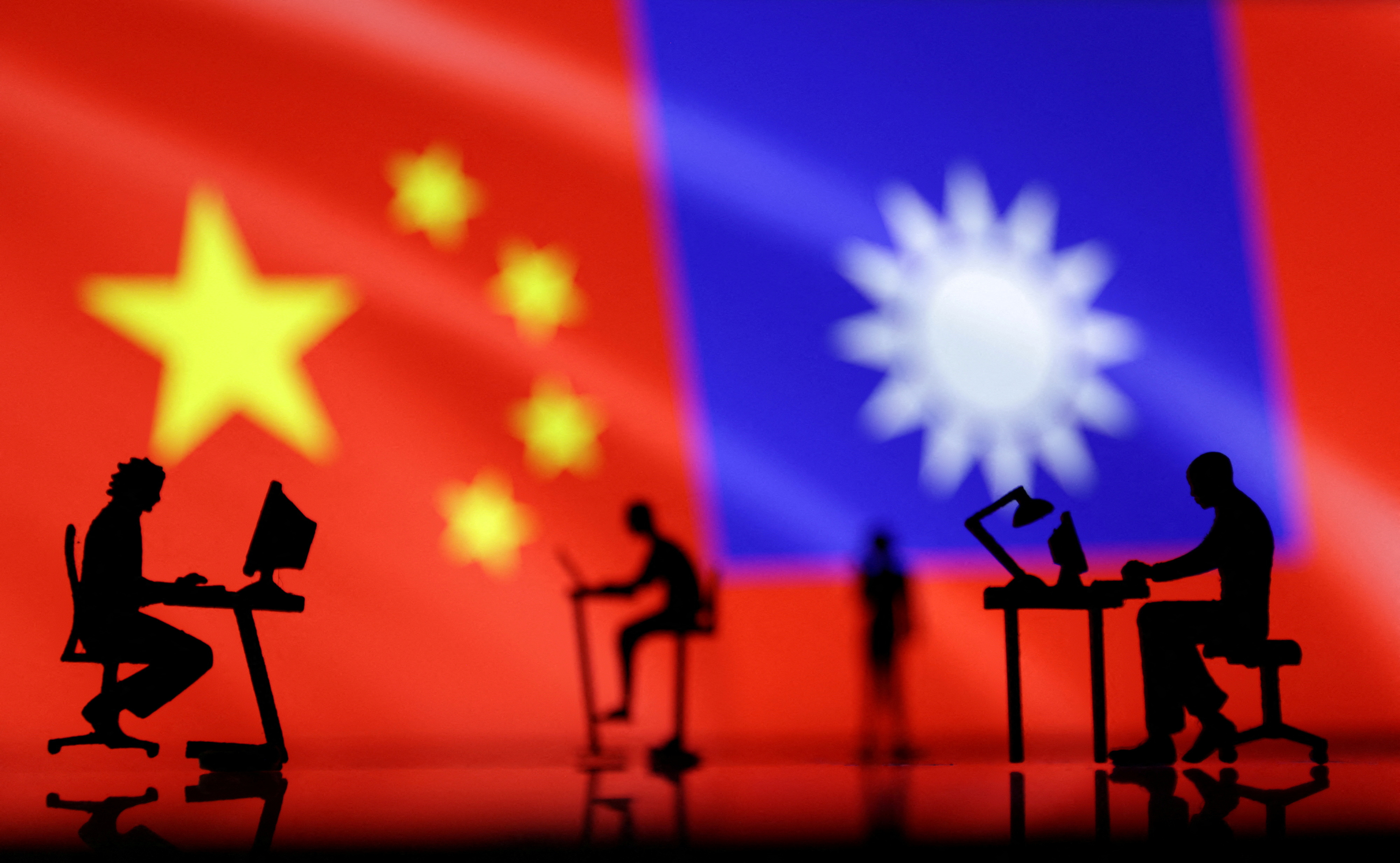 Illustration shows small figurines with computers, Chinese and Taiwanese flags