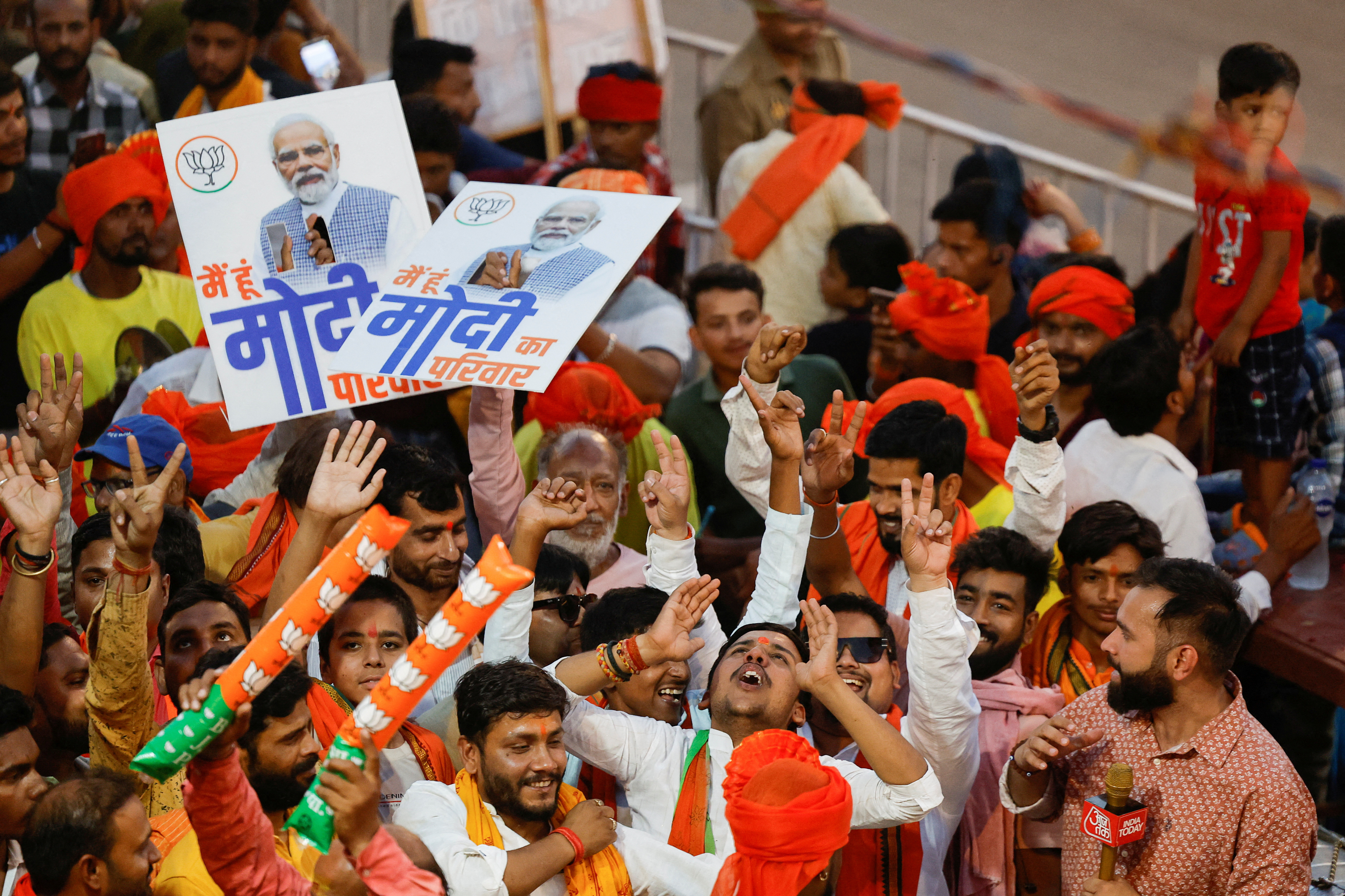 Supporters of India's Prime Minister Narendra Modi react, on the day of a Bharatiya Janata Party (BJP) election campaign rally in Ayodhya